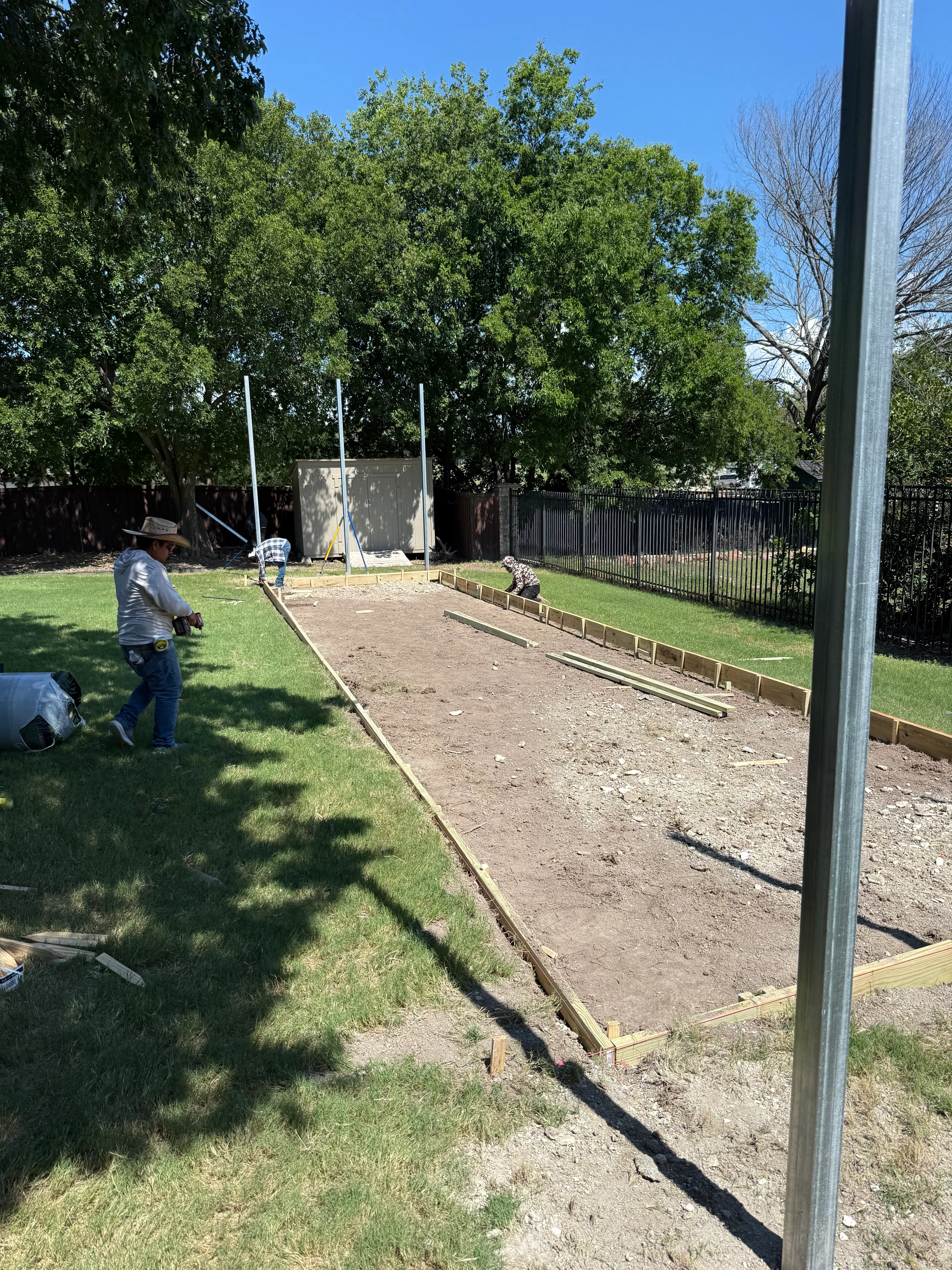 Construction 1 — Allen backyard batting cage: Cimarron 55x12x12 net on steel posts, crushed-concrete base, clay batter's box