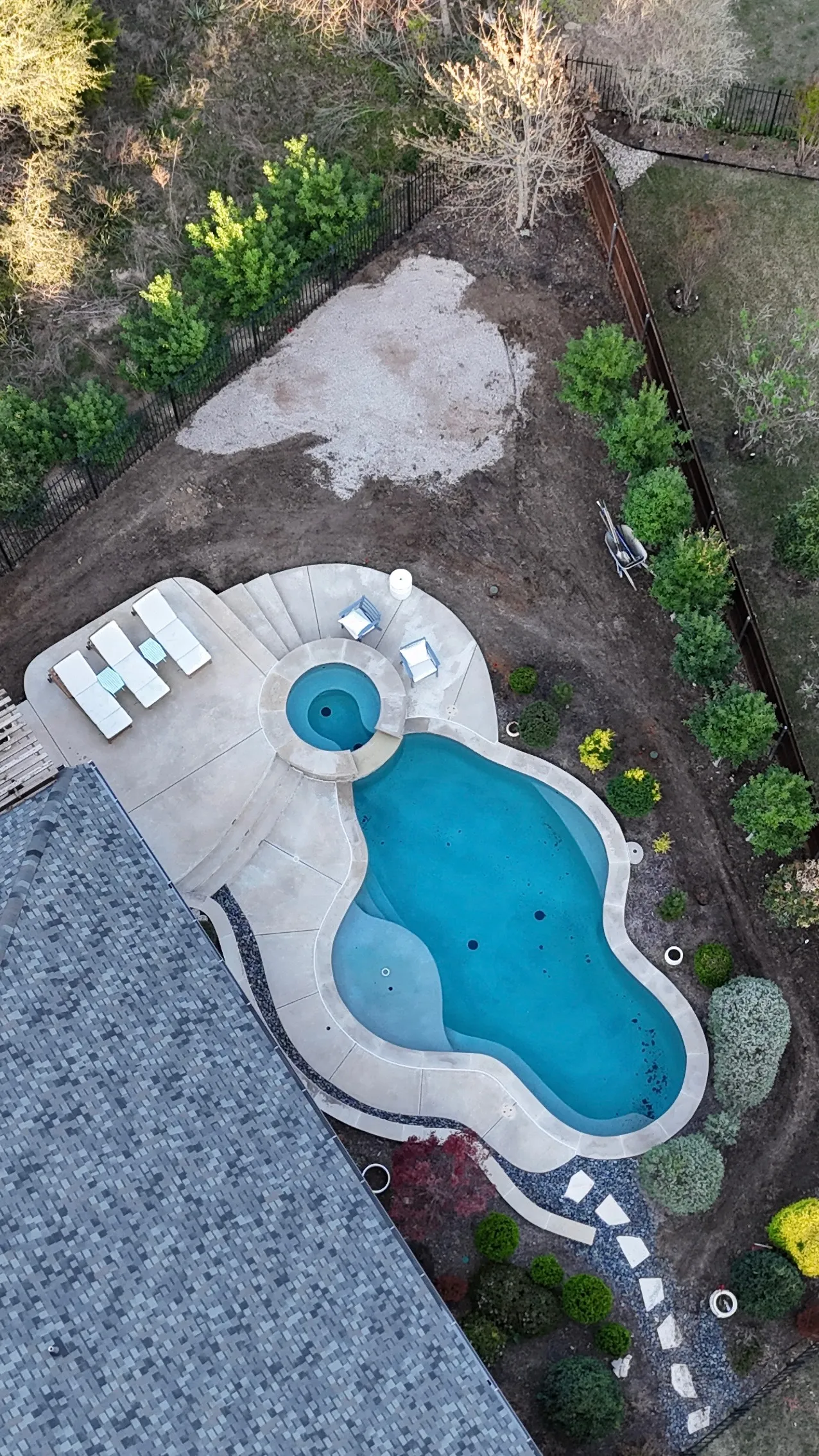Construction 2 — Parks of Aledo backyard conversion: 1,750 SF of turf that disappears into the greenbelt, plus a paver walkway