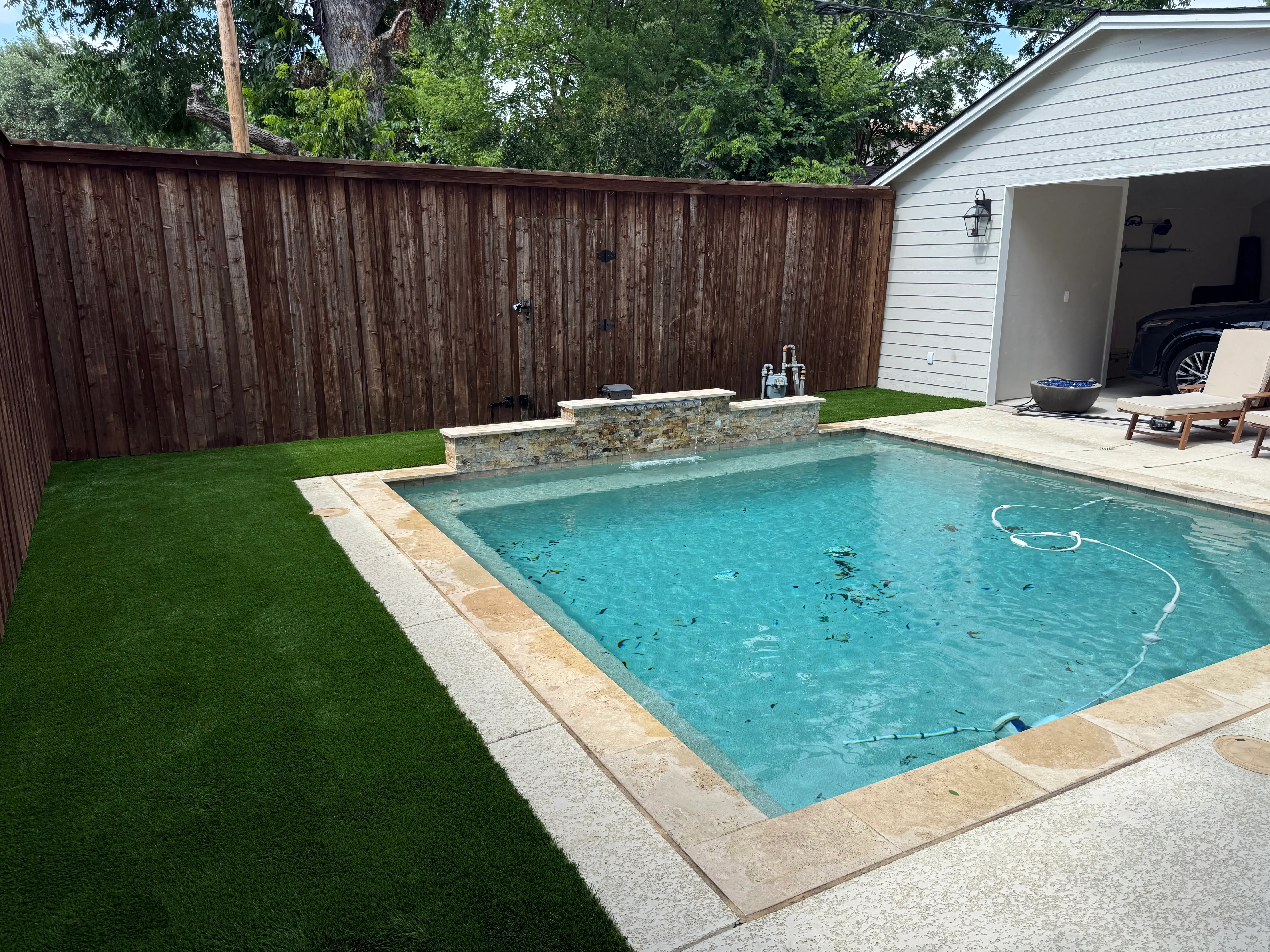 Monticello backyard: rocks out, Malibu 80 in — a Tudor glow-up off Camp Bowie feature 2