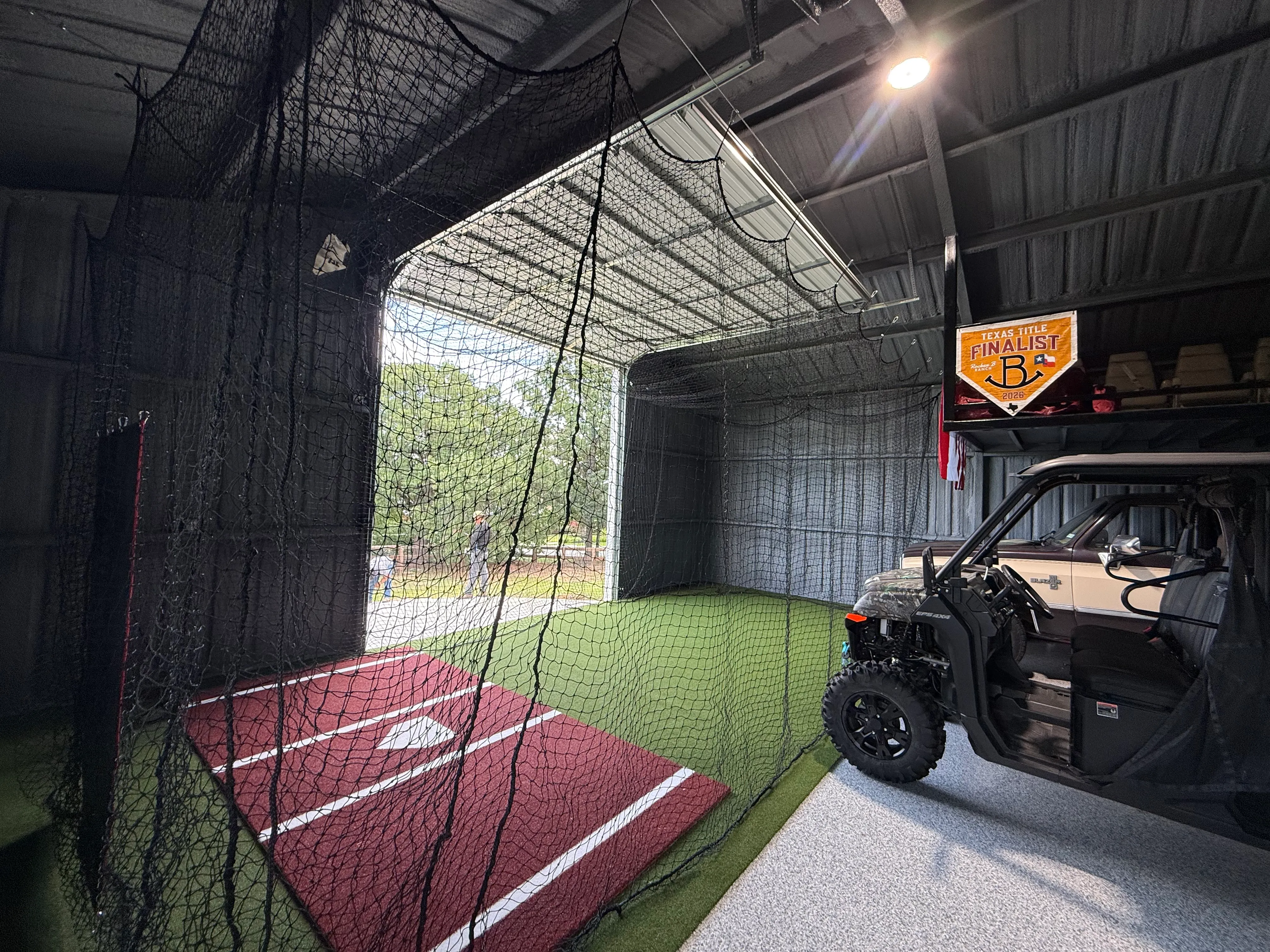 Argyle barn batting cage: Cimarron nets hung from the rafters, Performance Pro turf, barn still works feature 1
