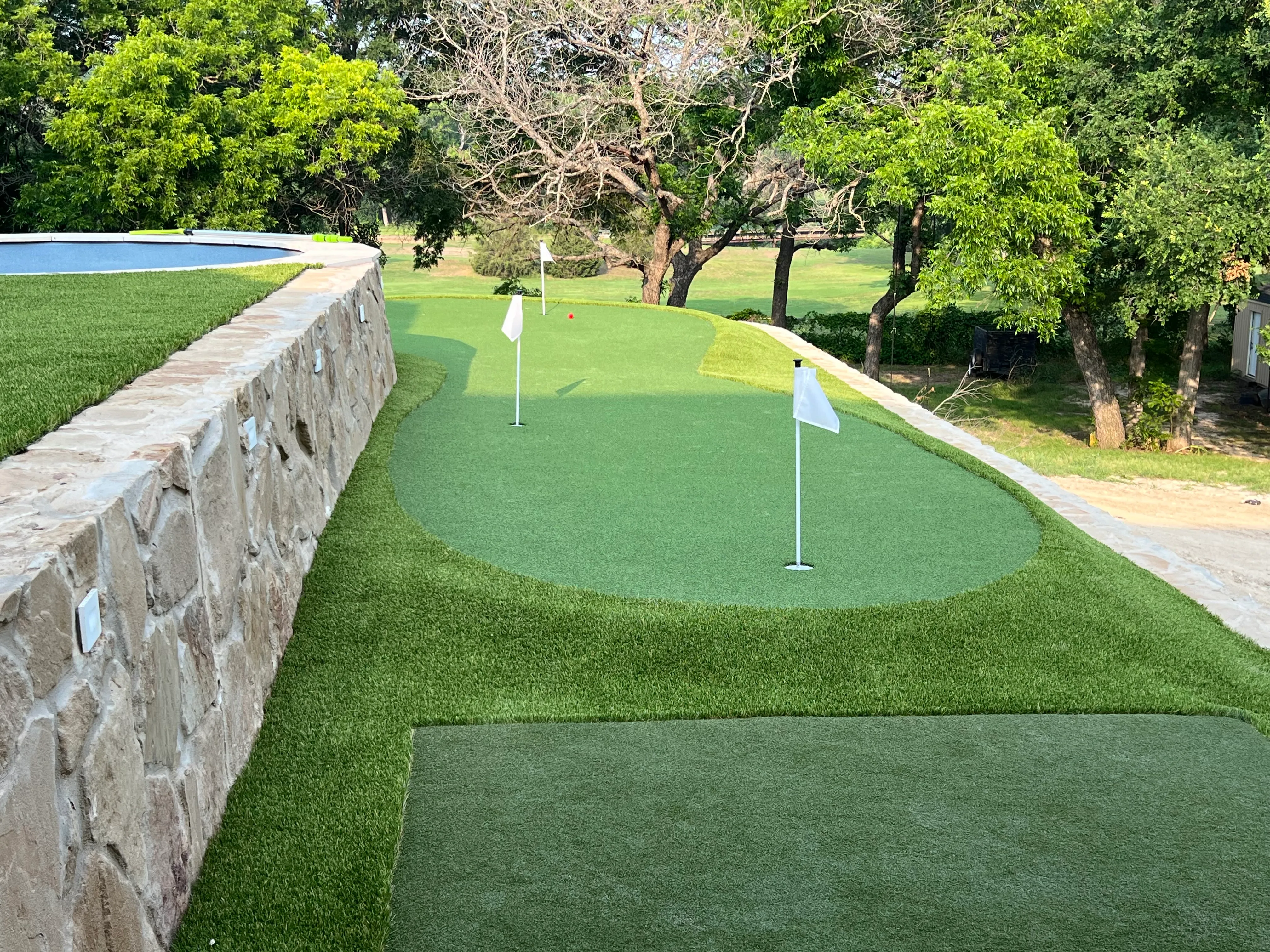 After 9 — Willow Park Multi-Level Putting Green & Pool Surround — On a Golf Course