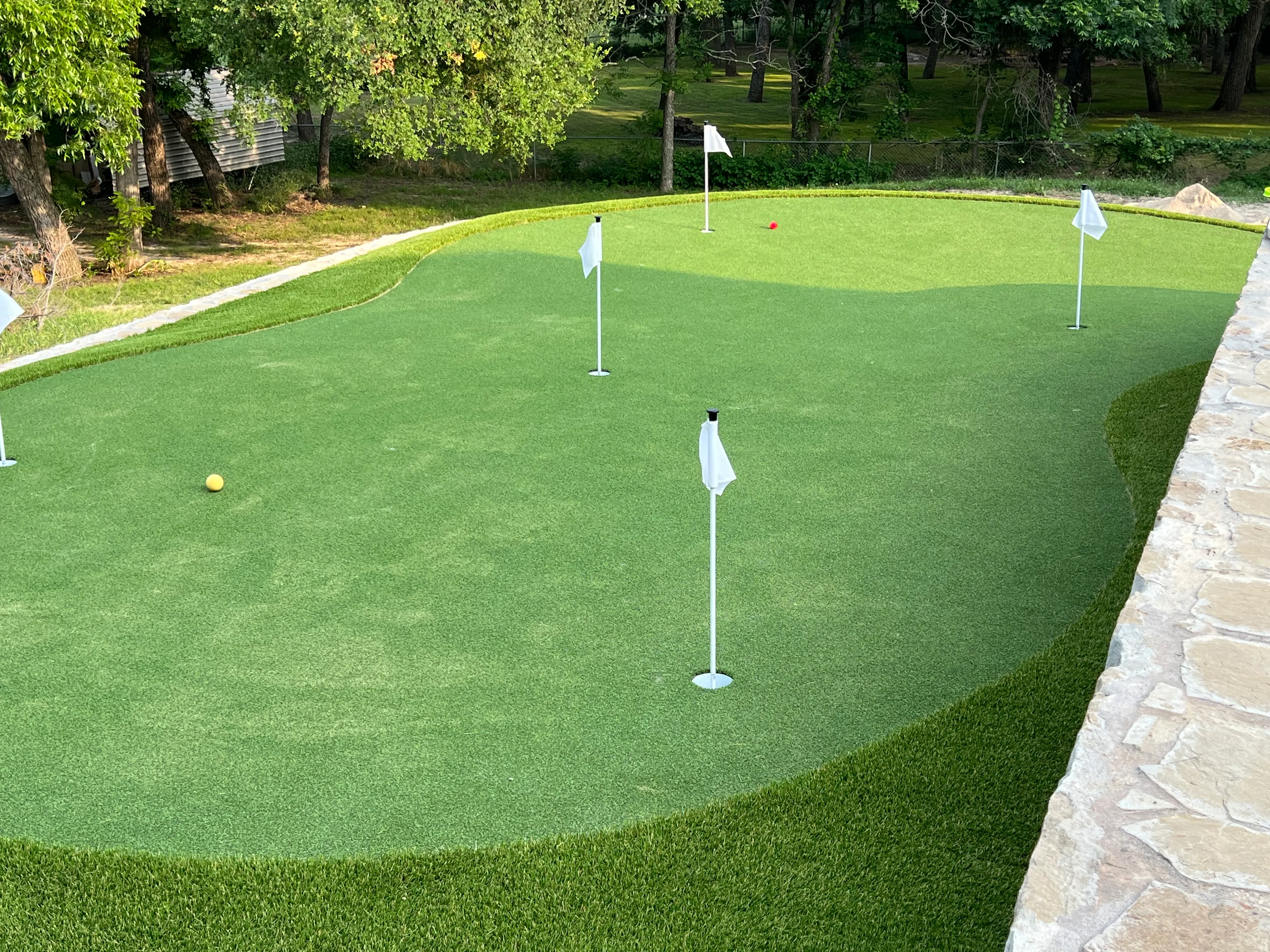 Bearcat artificial turf backyard install in Willow Park, TX (photo 21)