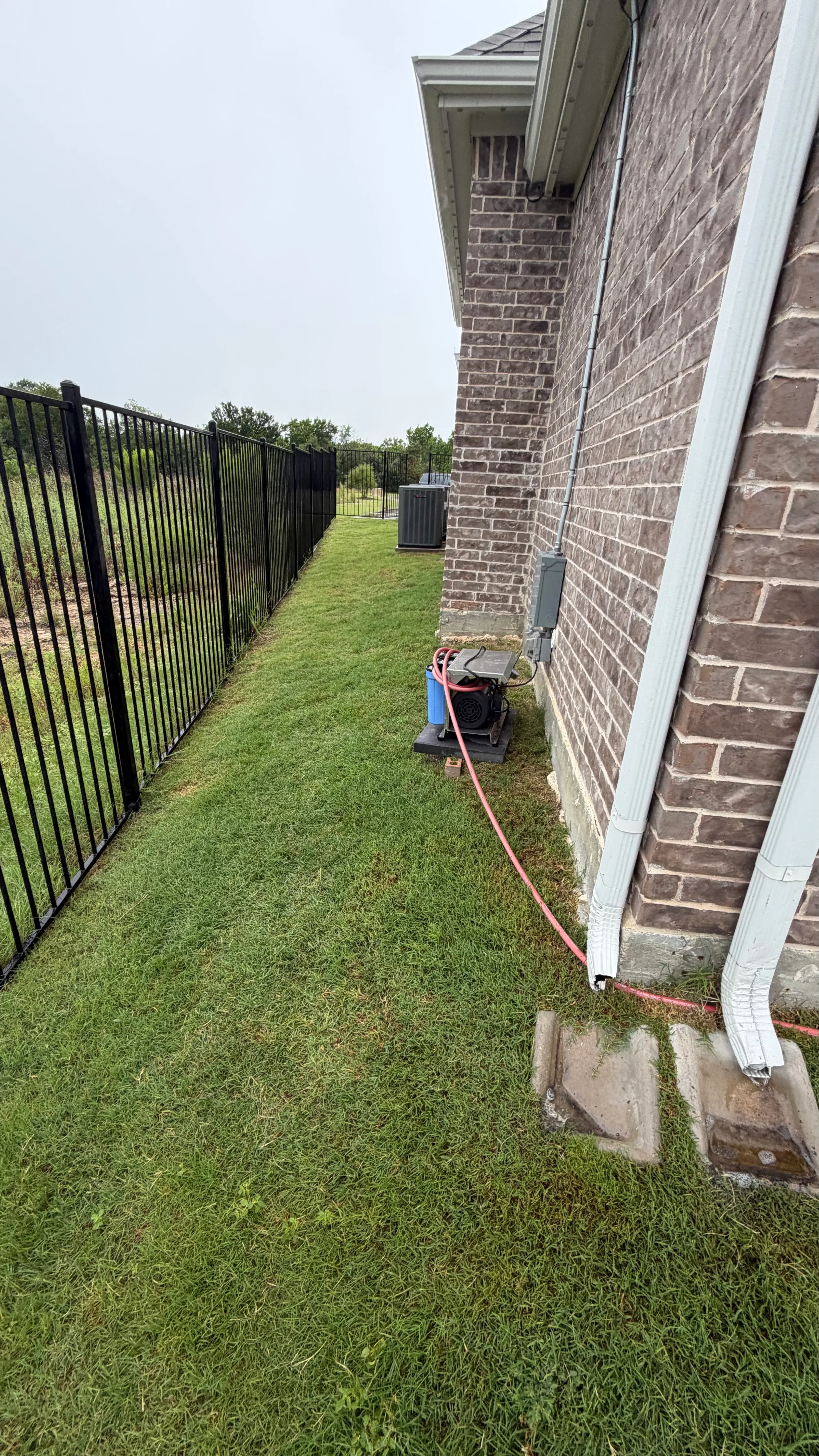 Before 4 — Parks of Aledo full backyard: 2,900 SF of Rymar TriBlend that disappears into the greenbelt