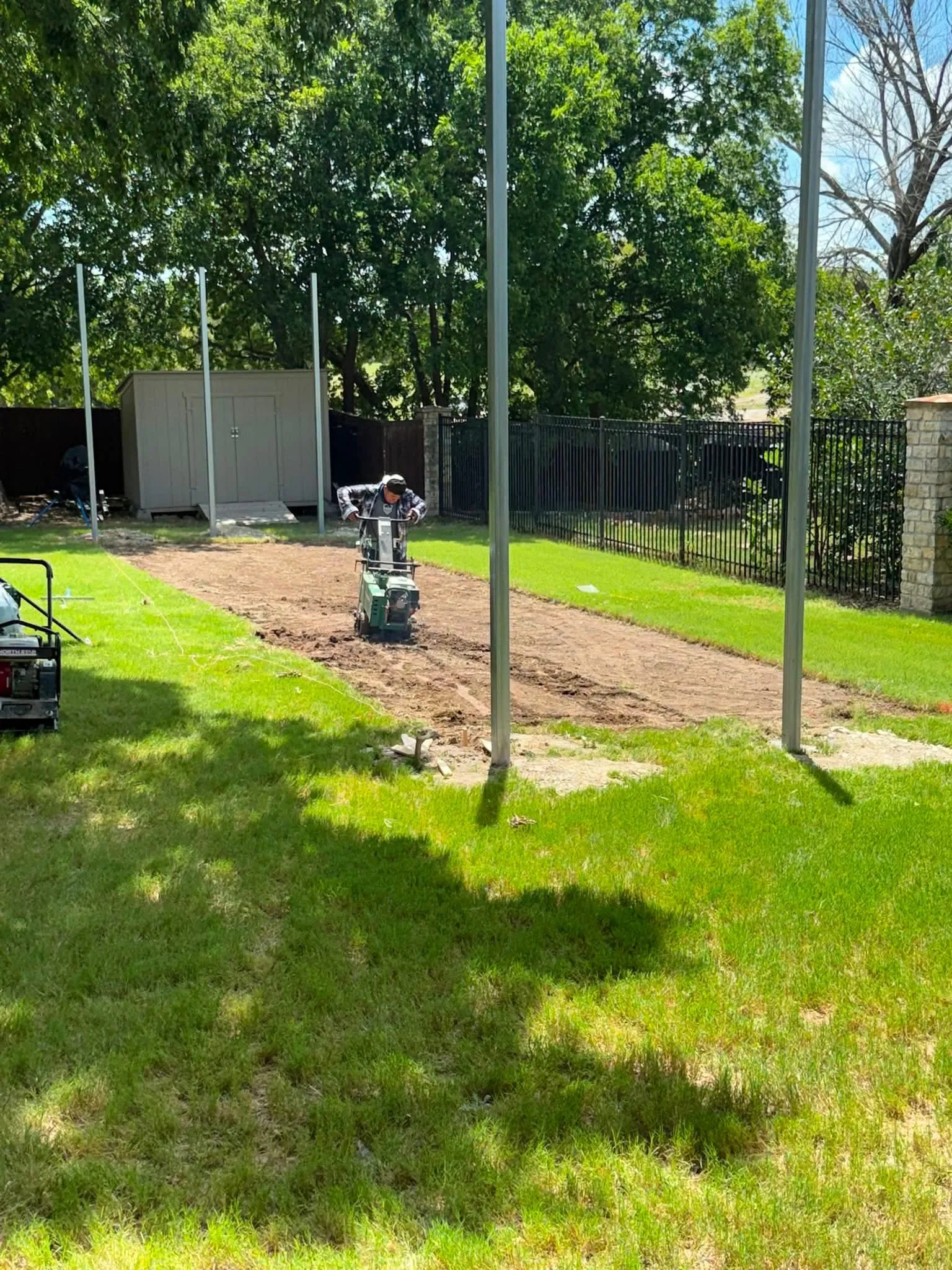 Construction 4 — Allen backyard batting cage: Cimarron 55x12x12 net on steel posts, crushed-concrete base, clay batter's box