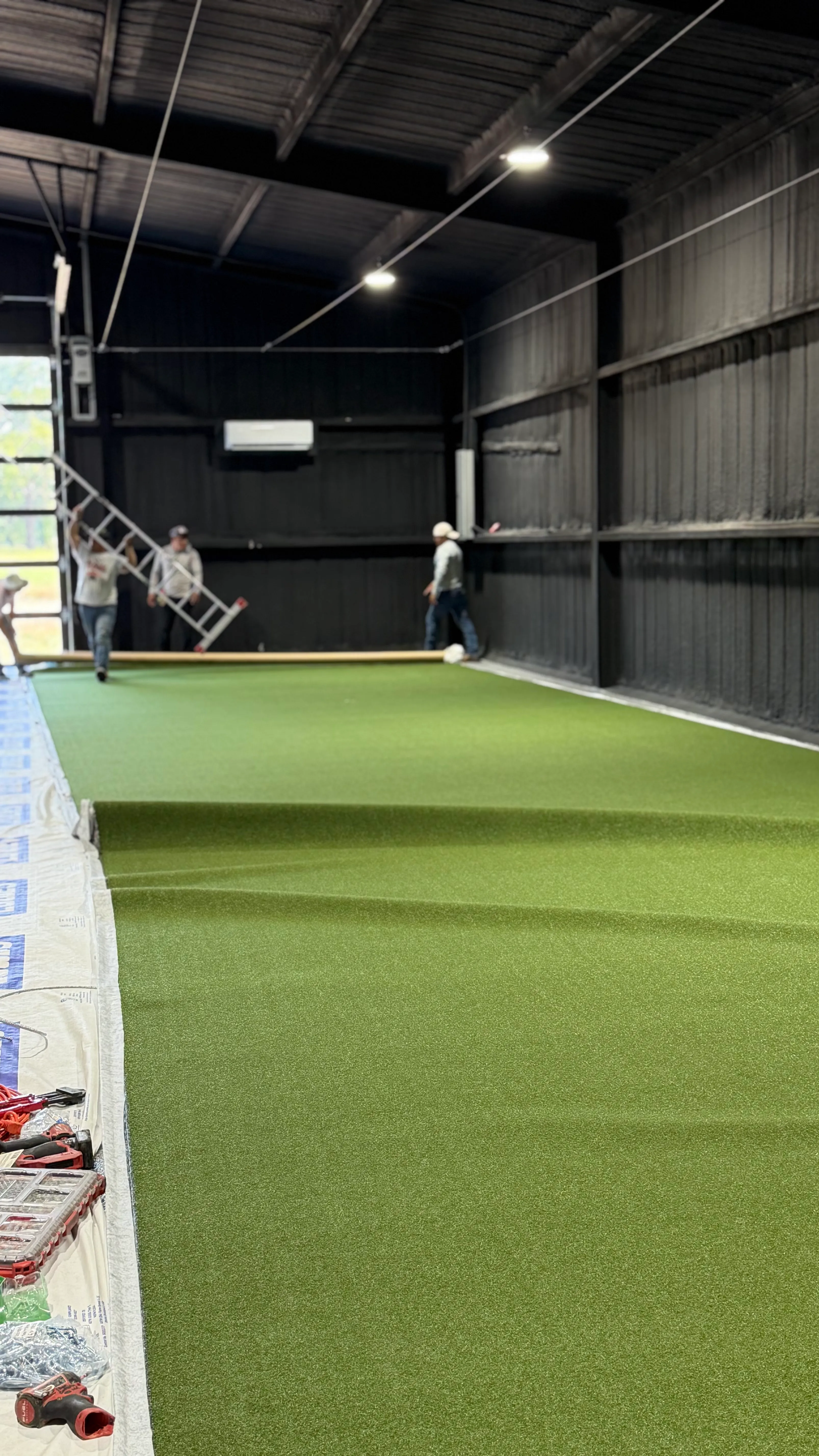 Construction 2 — Aledo backyard barn batting cage: 70' full-length retractable Cimarron net, Performance Pro turf, clay batter's box