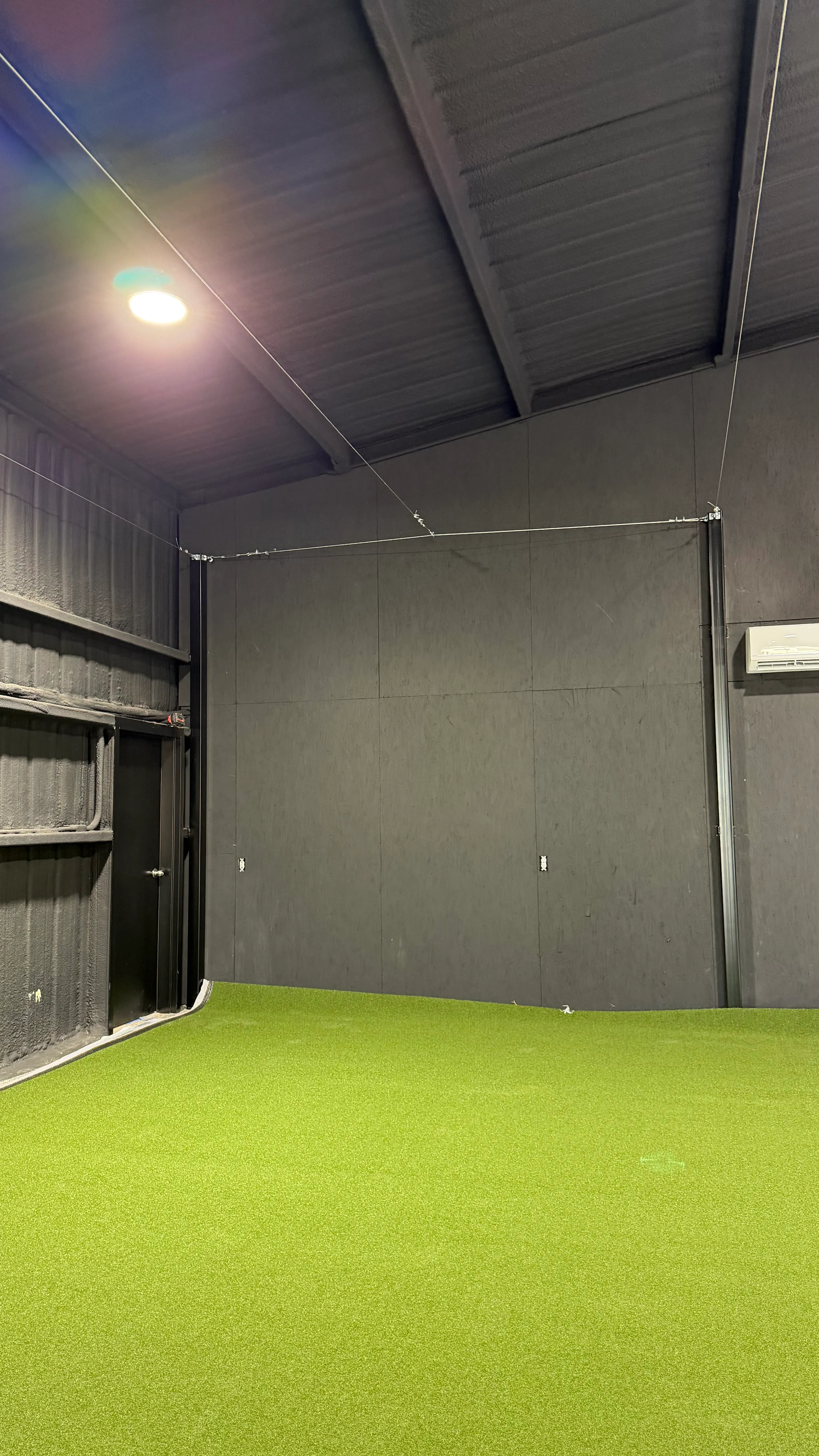 Construction 3 — Aledo backyard barn batting cage: 70' full-length retractable Cimarron net, Performance Pro turf, clay batter's box