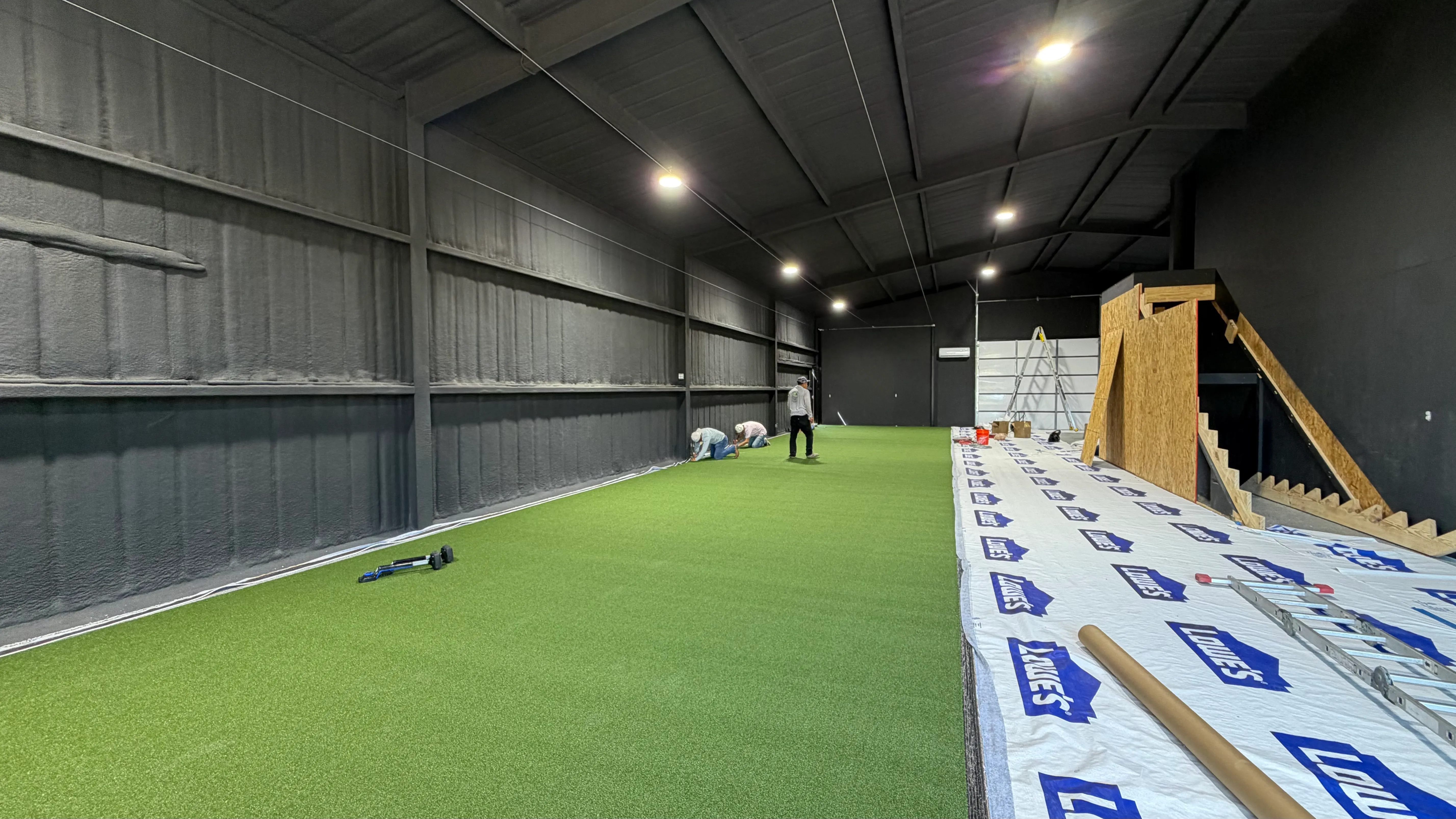 Construction 5 — Aledo backyard barn batting cage: 70' full-length retractable Cimarron net, Performance Pro turf, clay batter's box