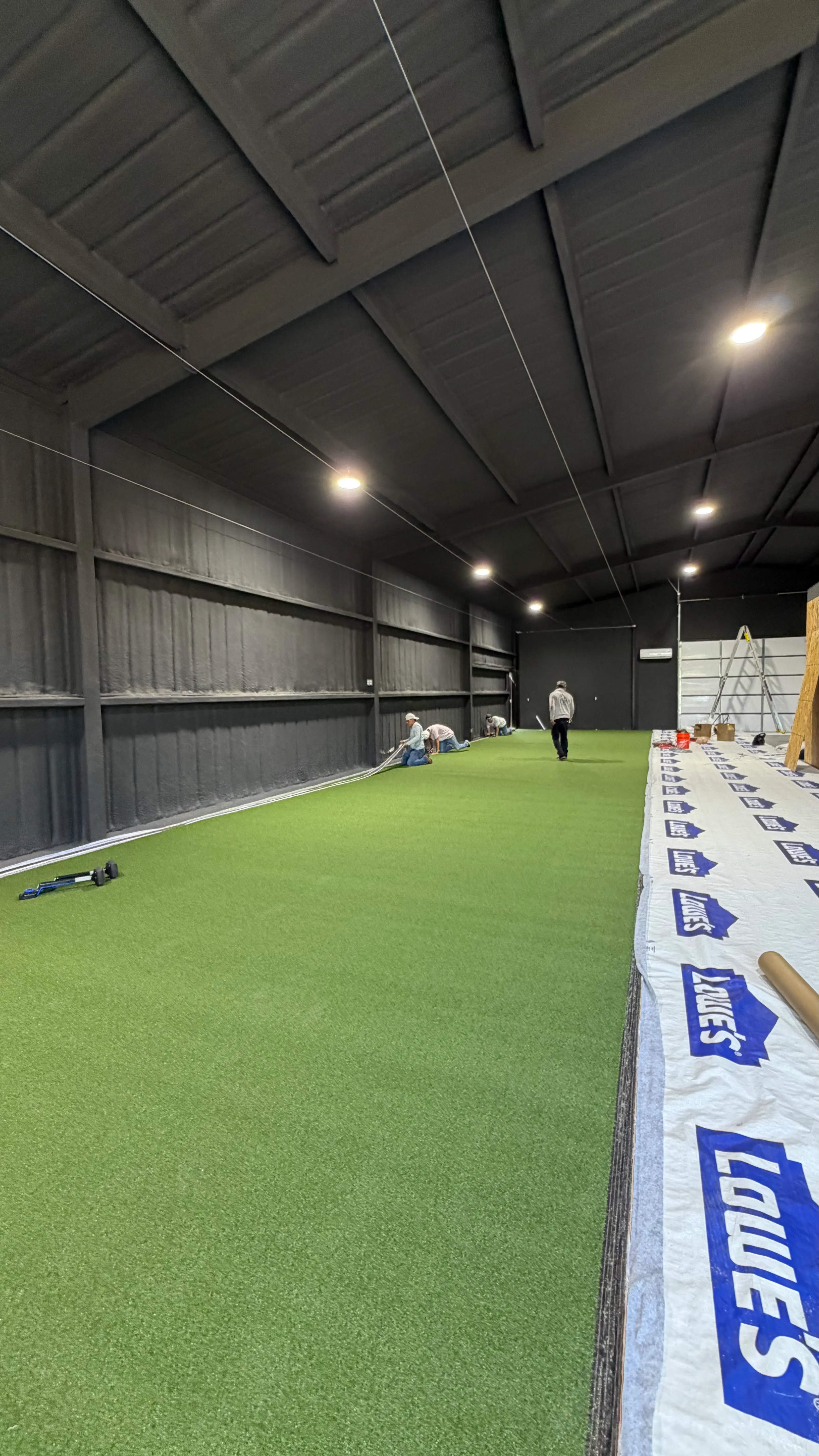 Construction 6 — Aledo backyard barn batting cage: 70' full-length retractable Cimarron net, Performance Pro turf, clay batter's box