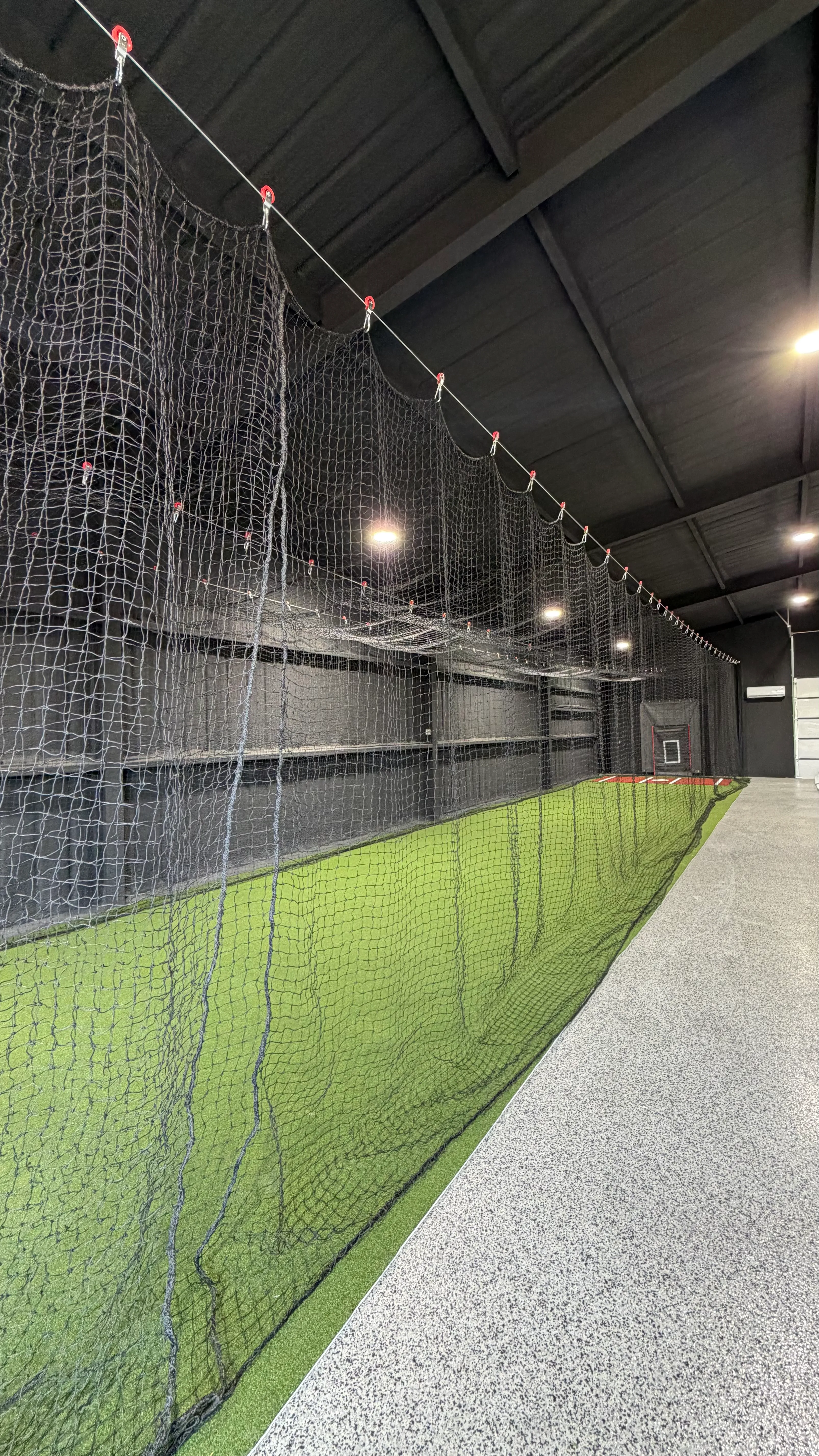 After 5 — Aledo backyard barn batting cage: 70' full-length retractable Cimarron net, Performance Pro turf, clay batter's box