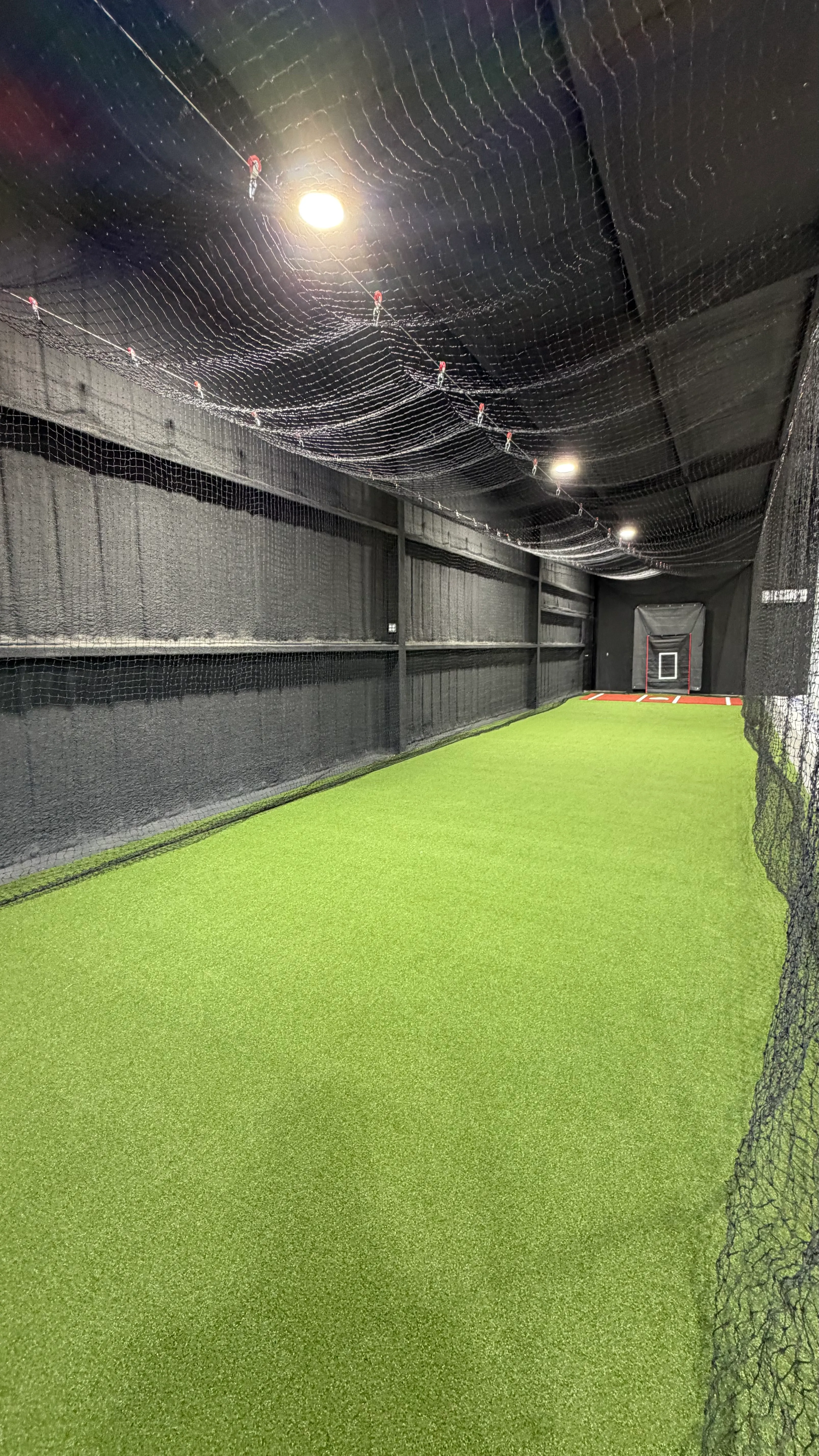 After 6 — Aledo backyard barn batting cage: 70' full-length retractable Cimarron net, Performance Pro turf, clay batter's box