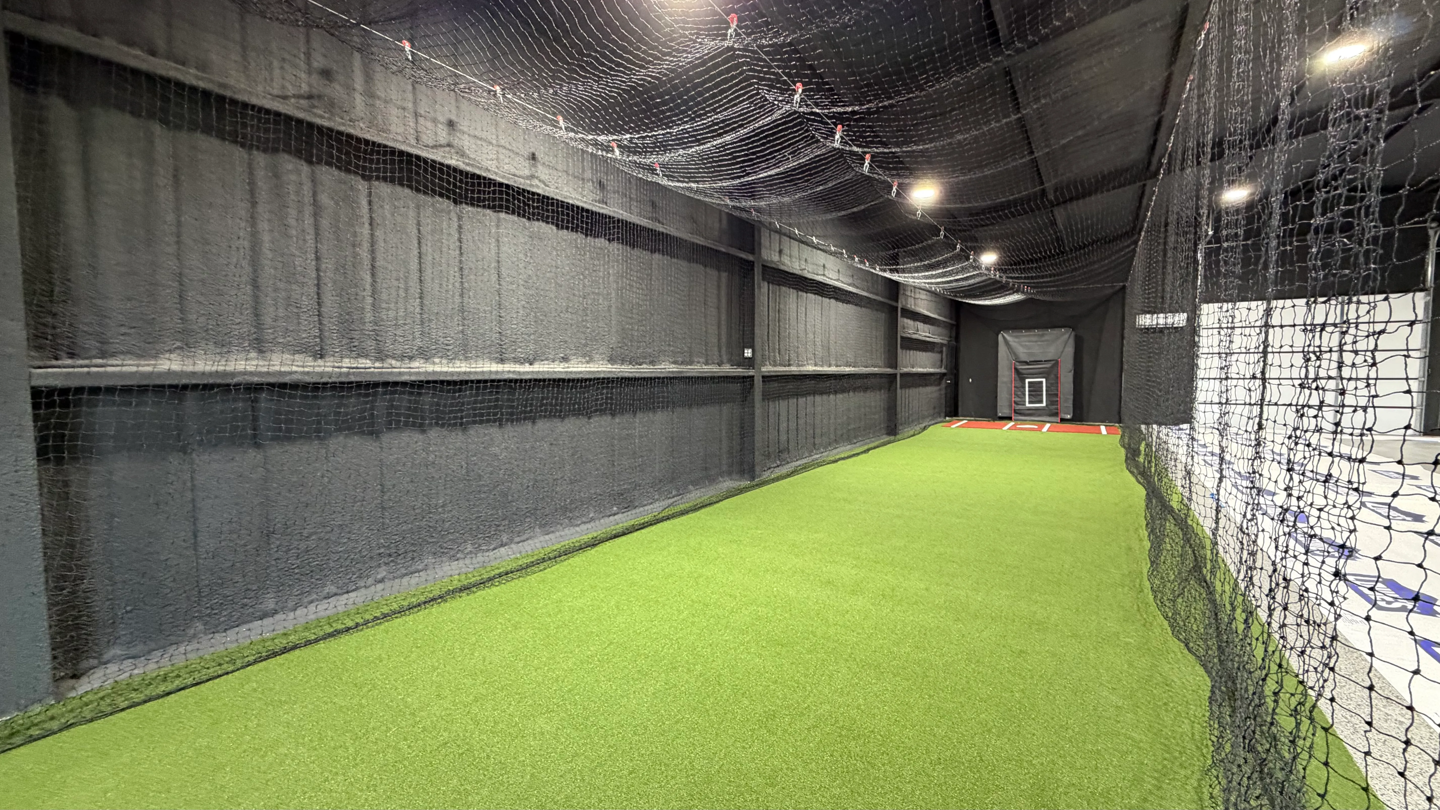 After 7 — Aledo backyard barn batting cage: 70' full-length retractable Cimarron net, Performance Pro turf, clay batter's box