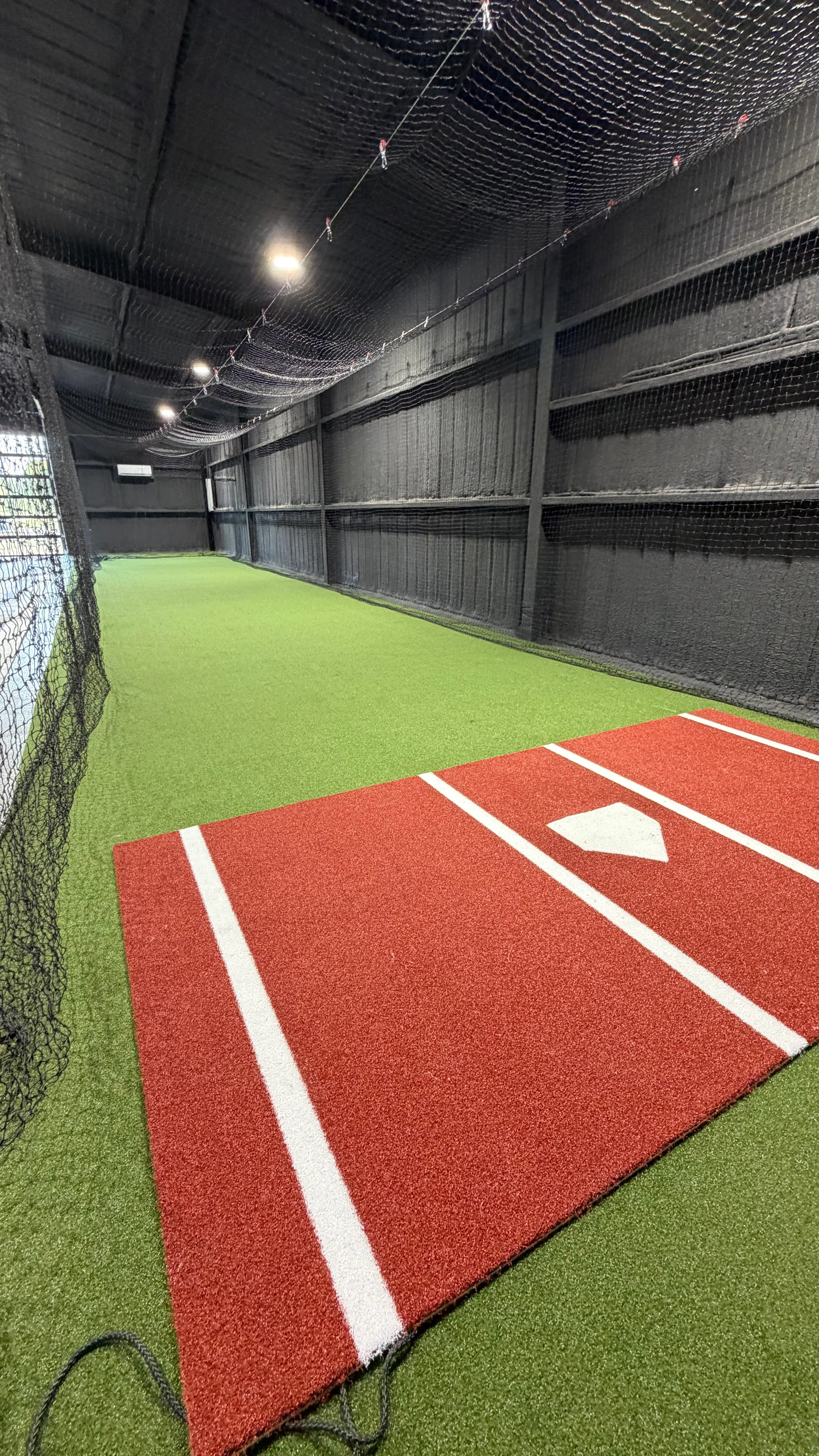 After 8 — Aledo backyard barn batting cage: 70' full-length retractable Cimarron net, Performance Pro turf, clay batter's box