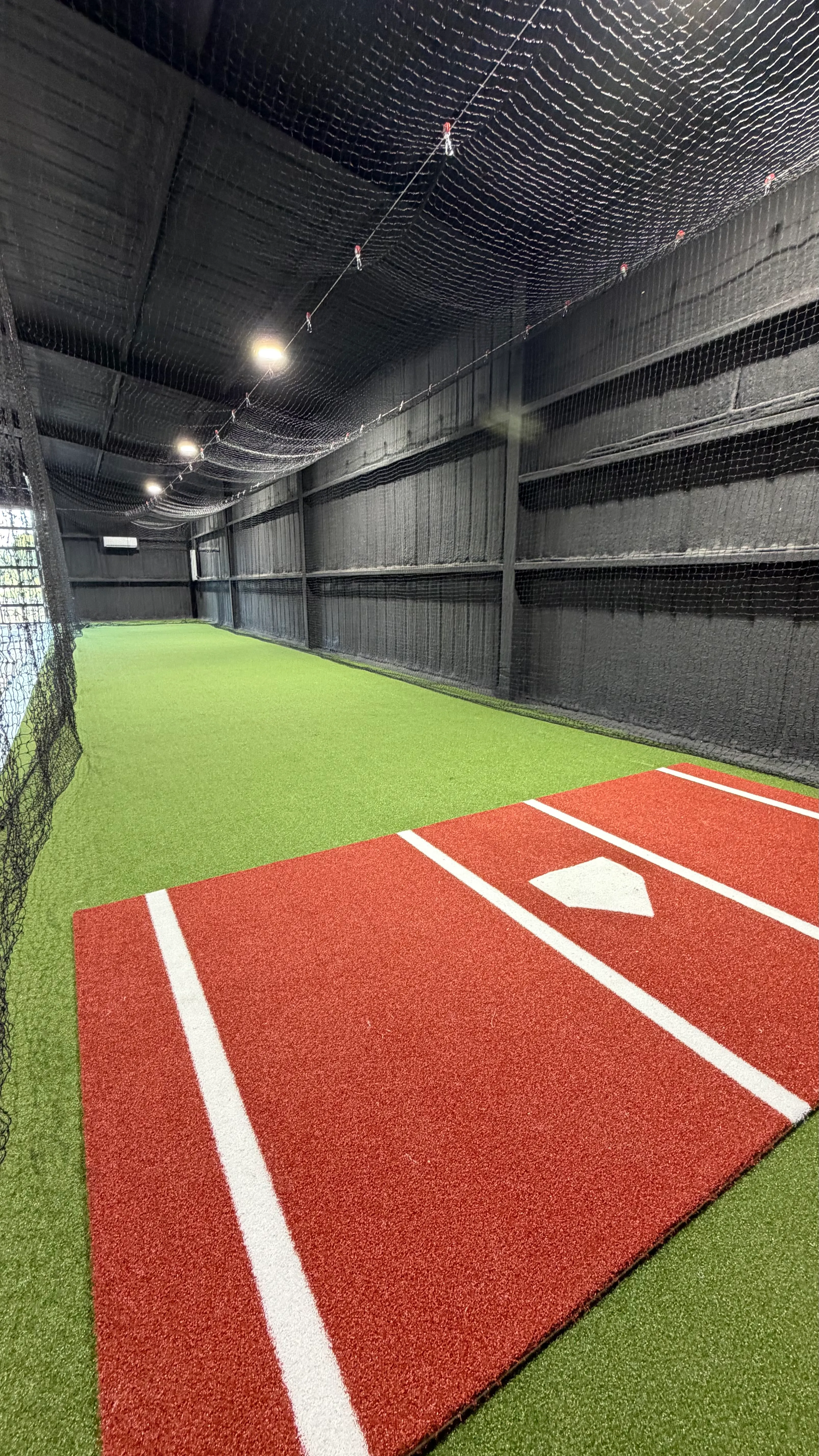 After 10 — Aledo backyard barn batting cage: 70' full-length retractable Cimarron net, Performance Pro turf, clay batter's box