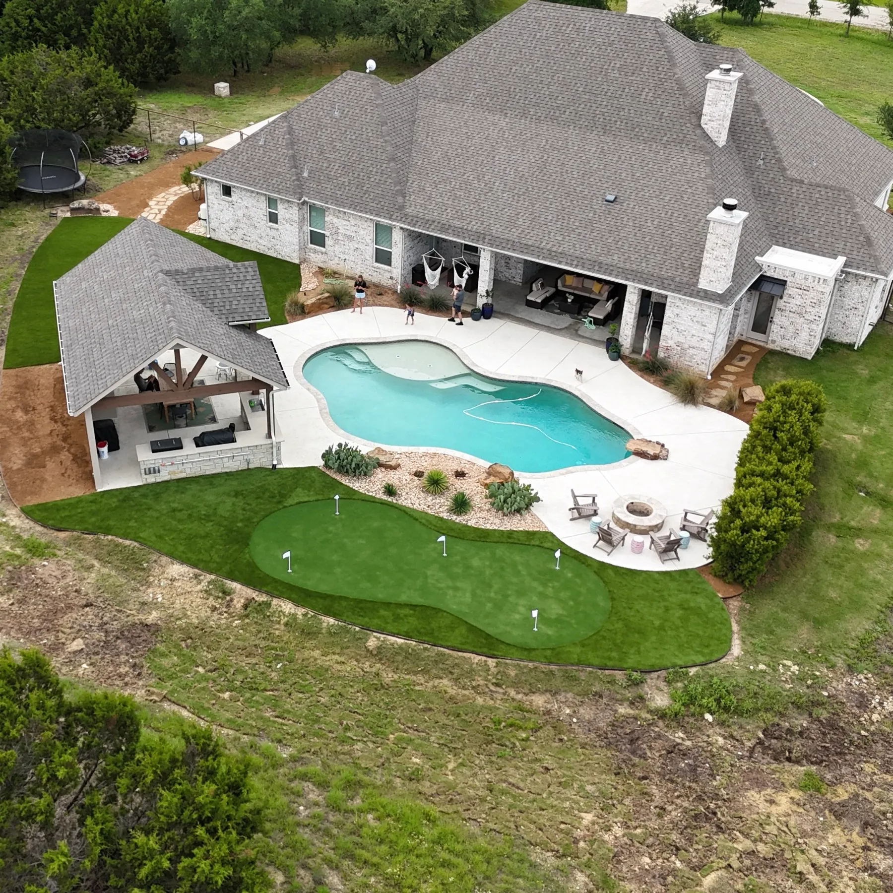 Aerial ranch estate with pool, artificial turf, and putting green in Aledo
