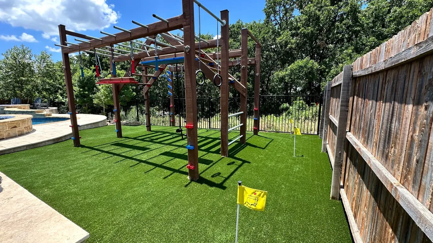 Backyard ninja-warrior rig on artificial turf
