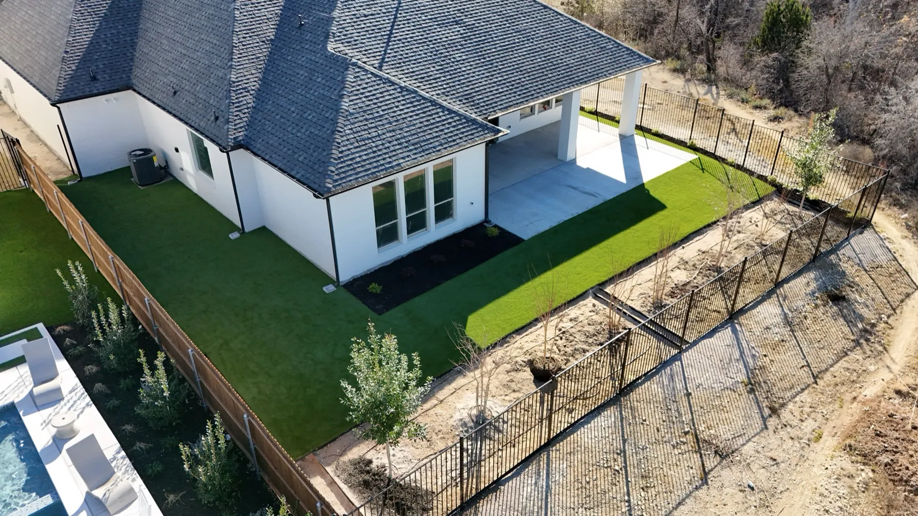 Aledo TX new-build backyard with artificial turf lawn and patio