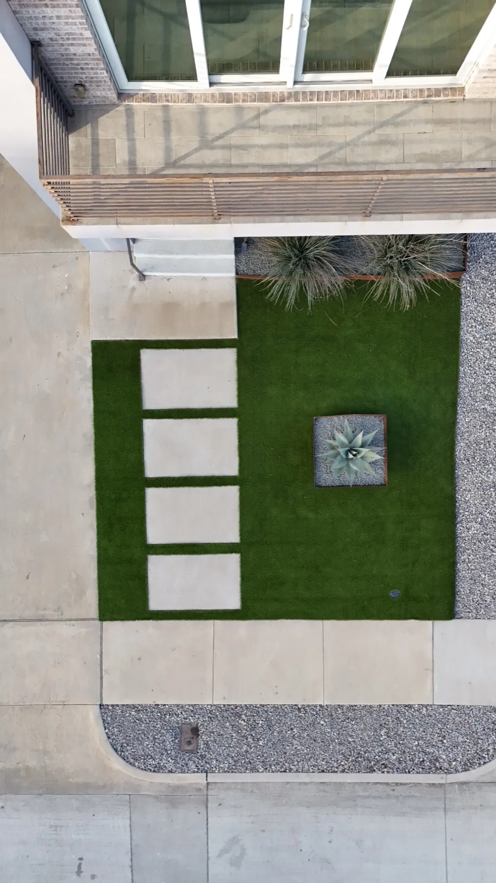 Top-down Fort Worth TX turf courtyard with paver stepping stones