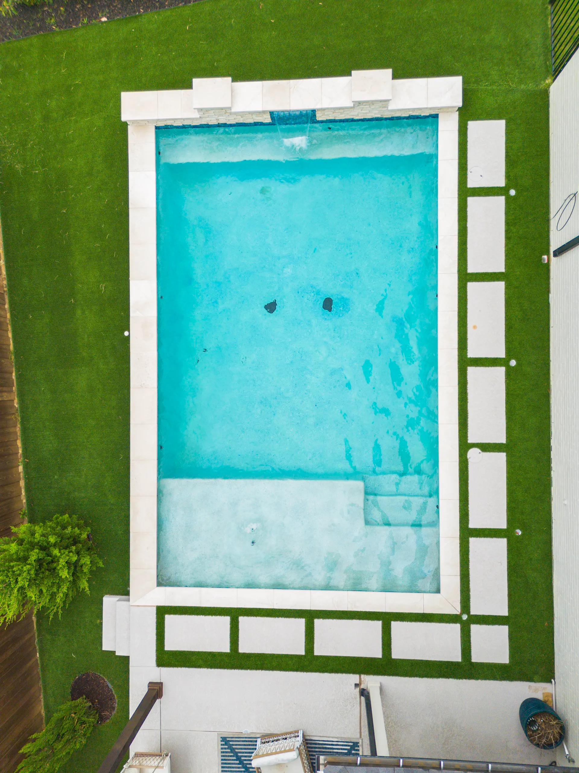 Aerial overhead view of pool with artificial turf border