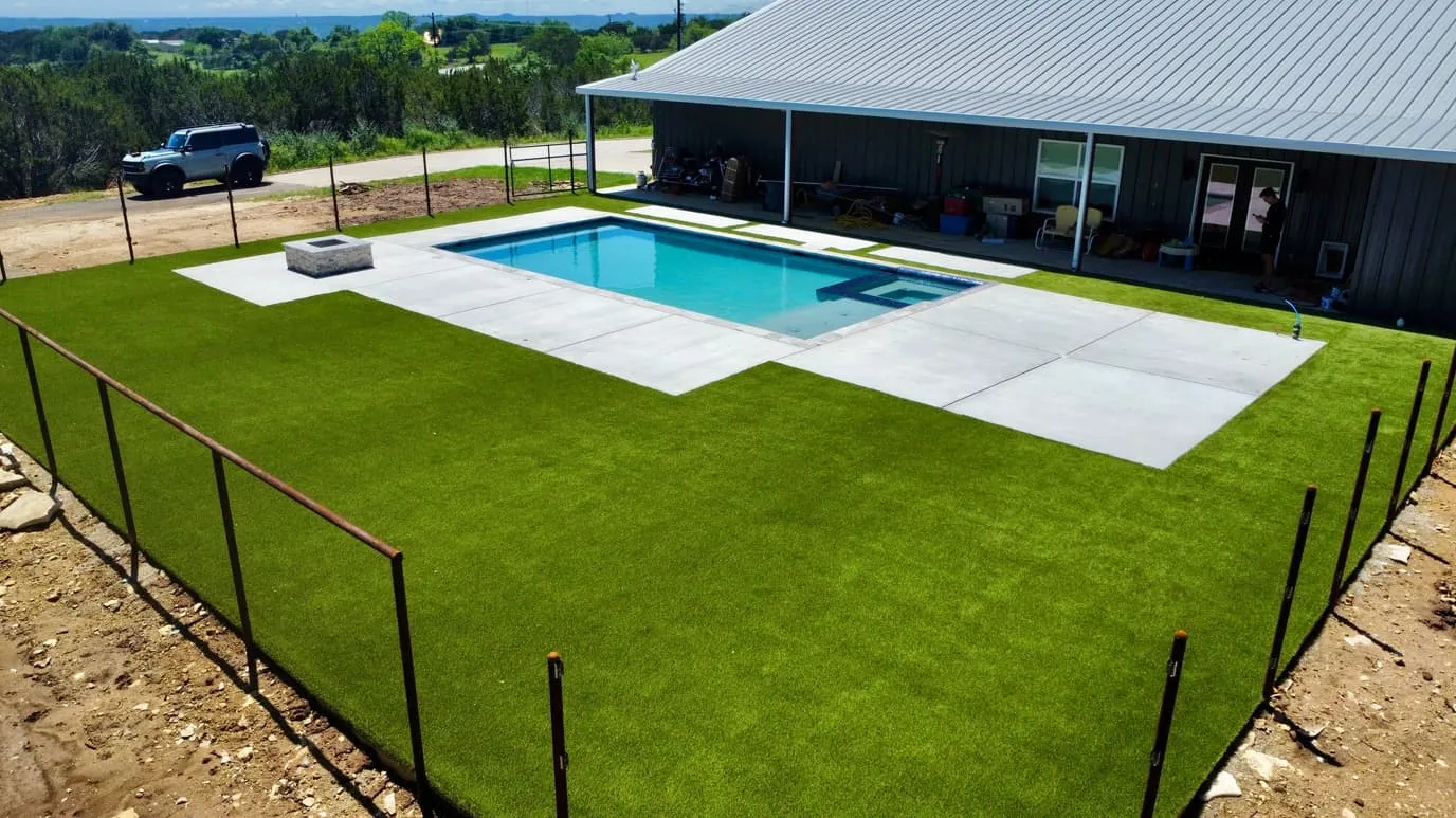 Aerial rural backyard pool with artificial turf in DFW
