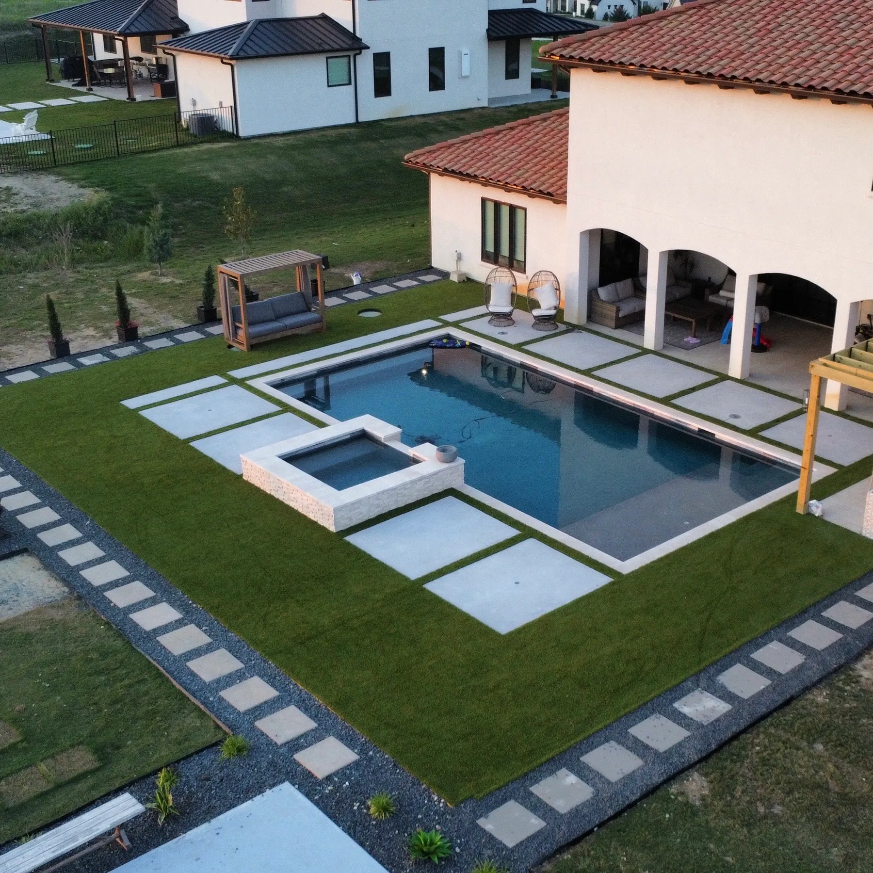 Aerial pool and spa with artificial turf border