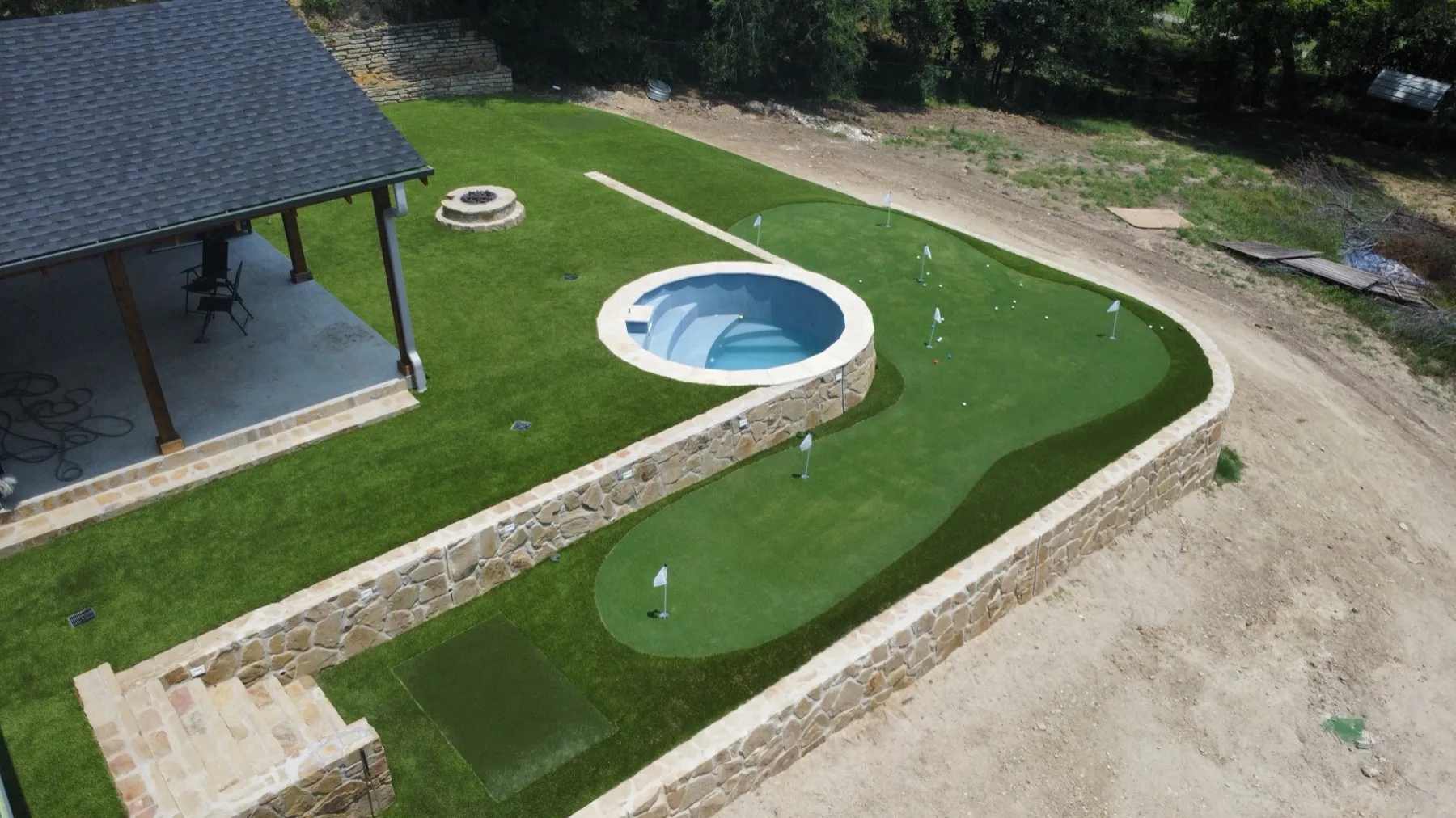 Backyard artificial putting green with chipping fringe