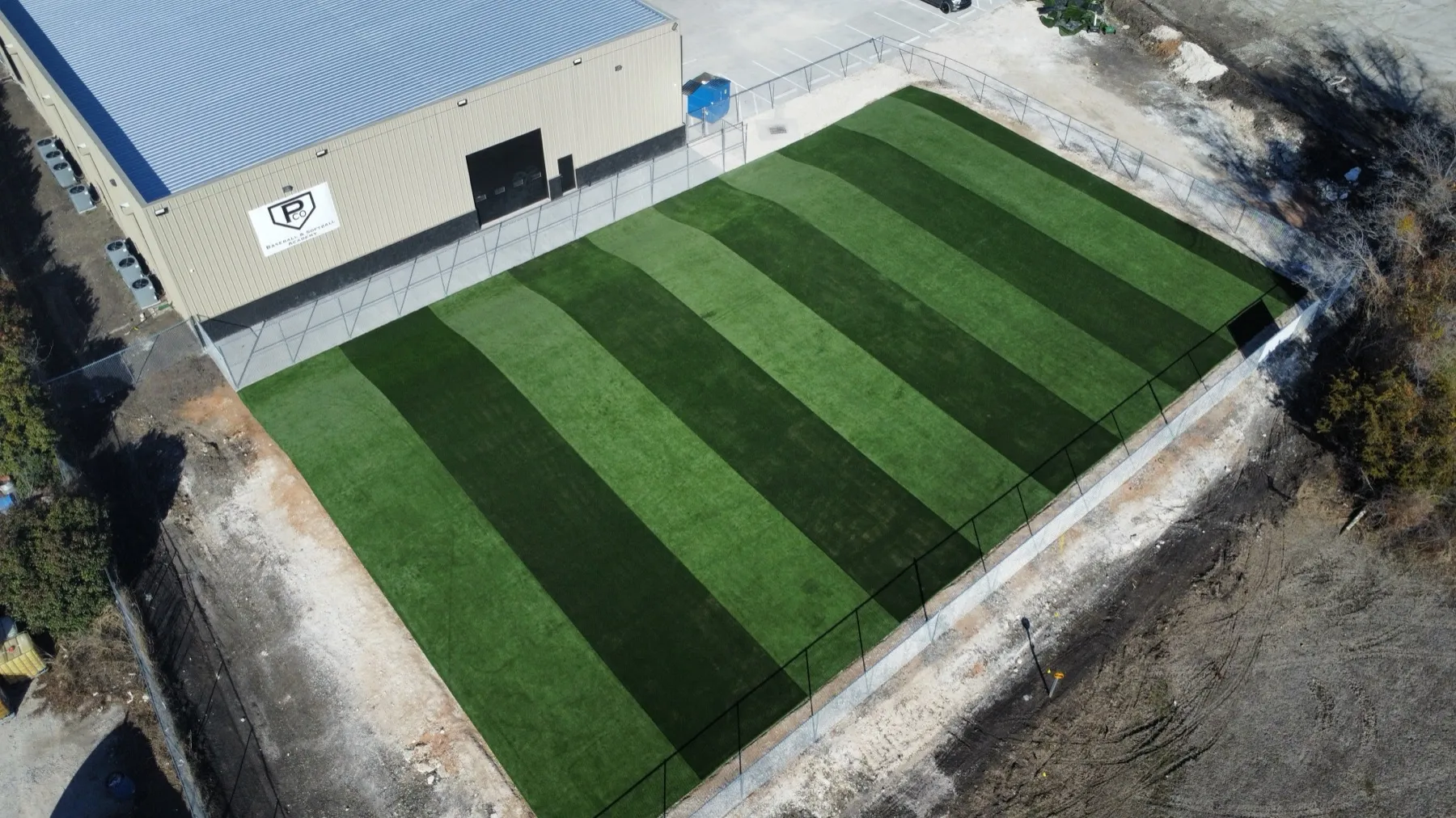 Aerial of baseball and softball academy batting turf stripes in DFW