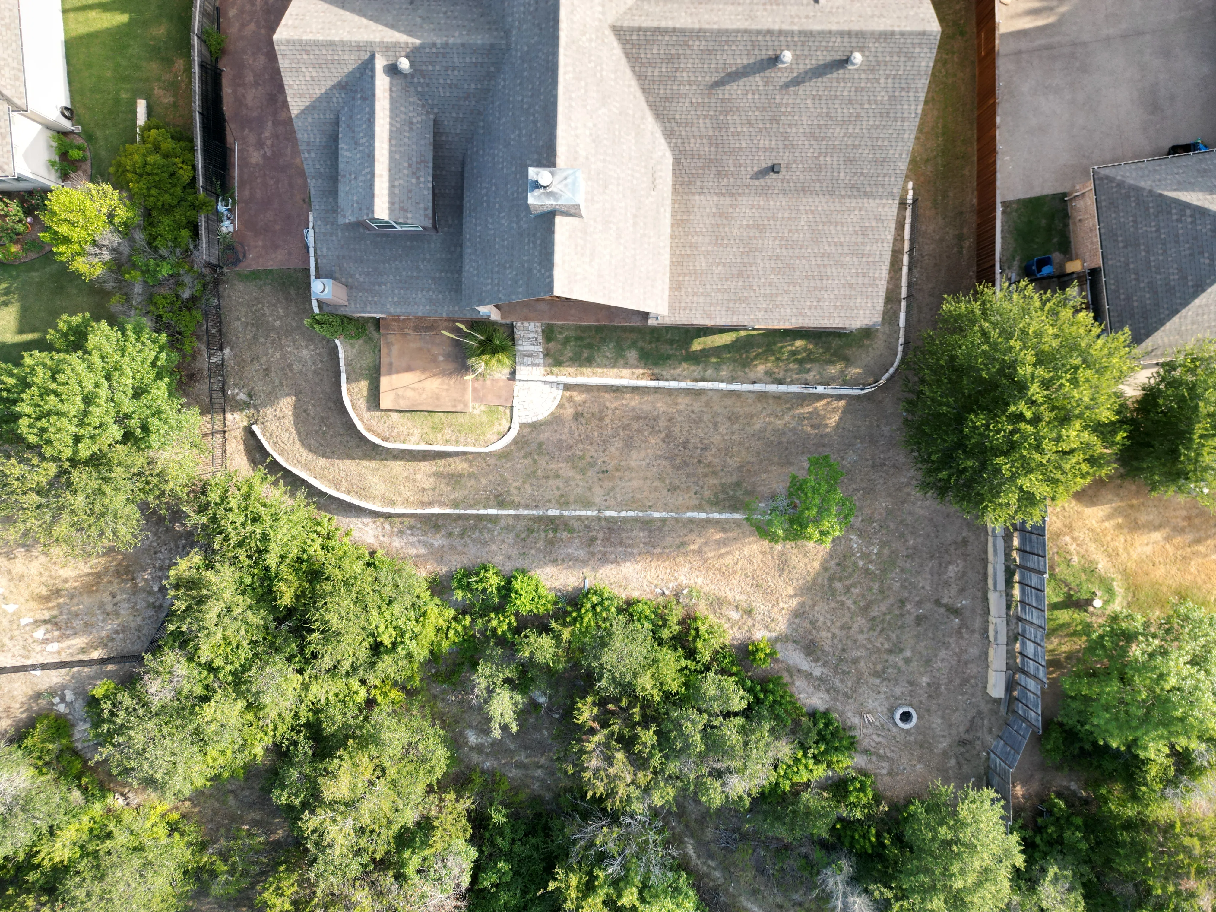 Before 6 — Aledo tiered backyard build: 606 SF Millsap retaining wall + 5,600 SF Bermuda Pro turf