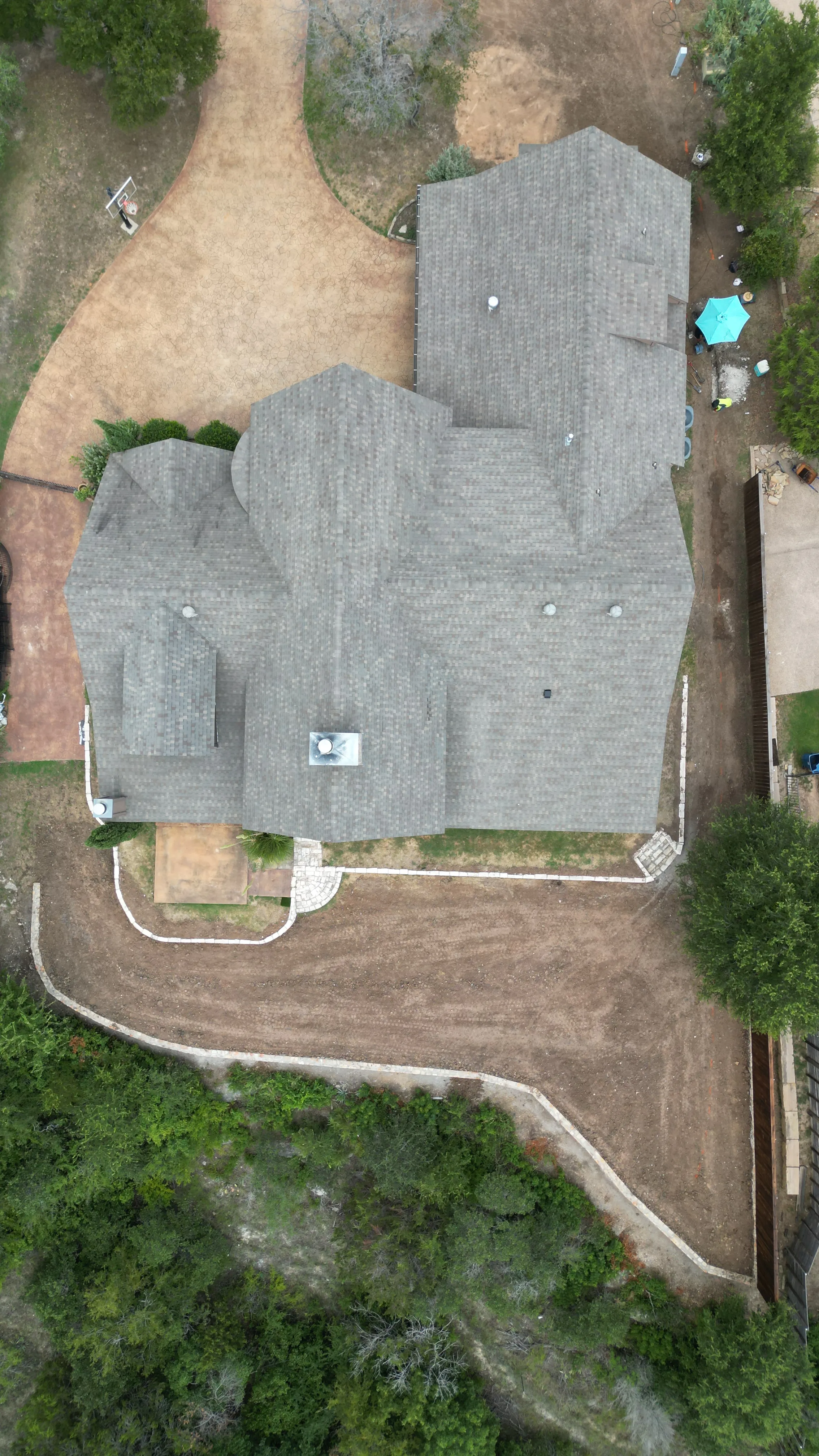 Construction 12 — Aledo tiered backyard build: 606 SF Millsap retaining wall + 5,600 SF Bermuda Pro turf
