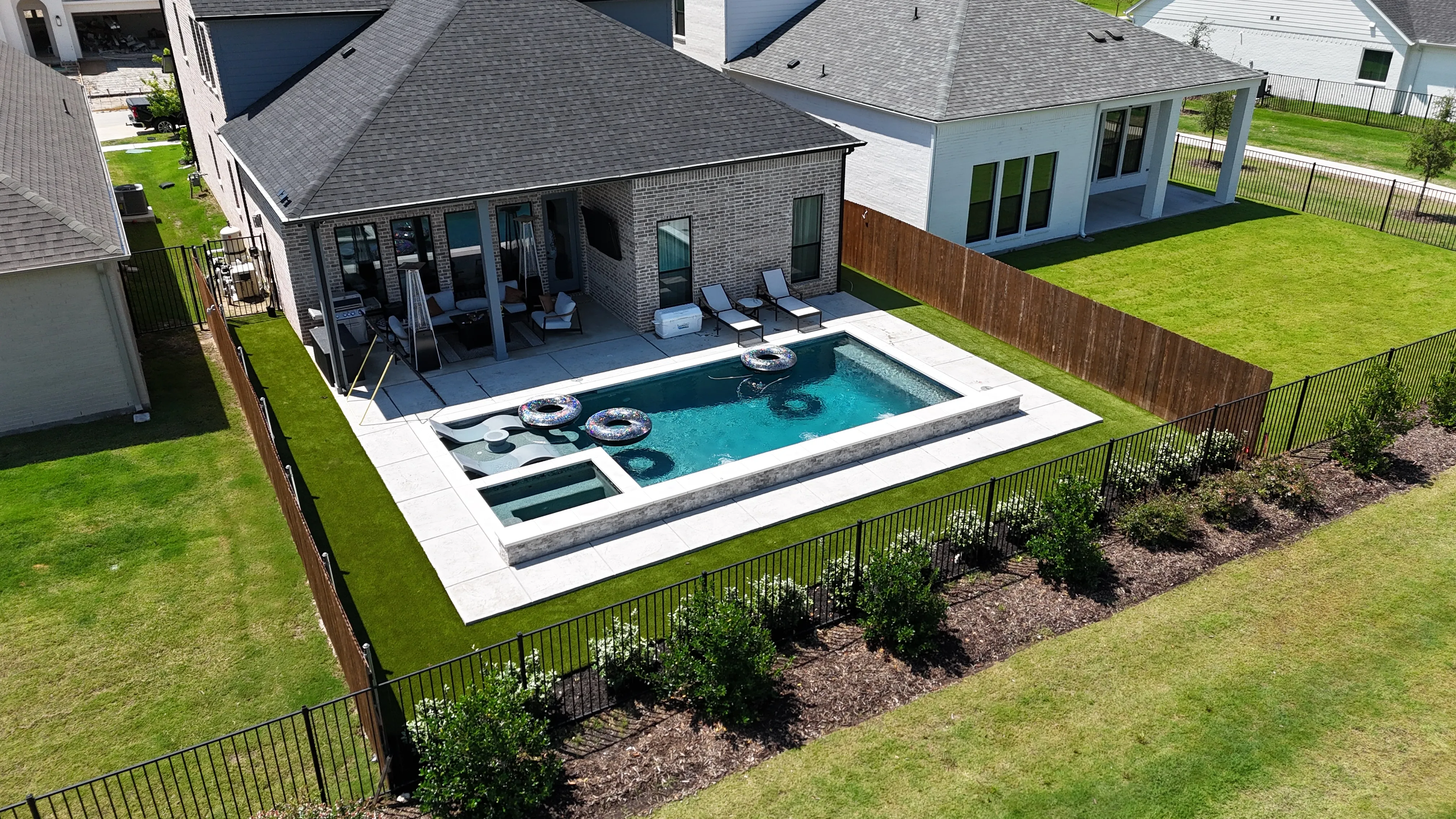 Complete backyard upgrade in a DFW master-planned community: 700 SF turf, privacy bushes, fence-line flower bed