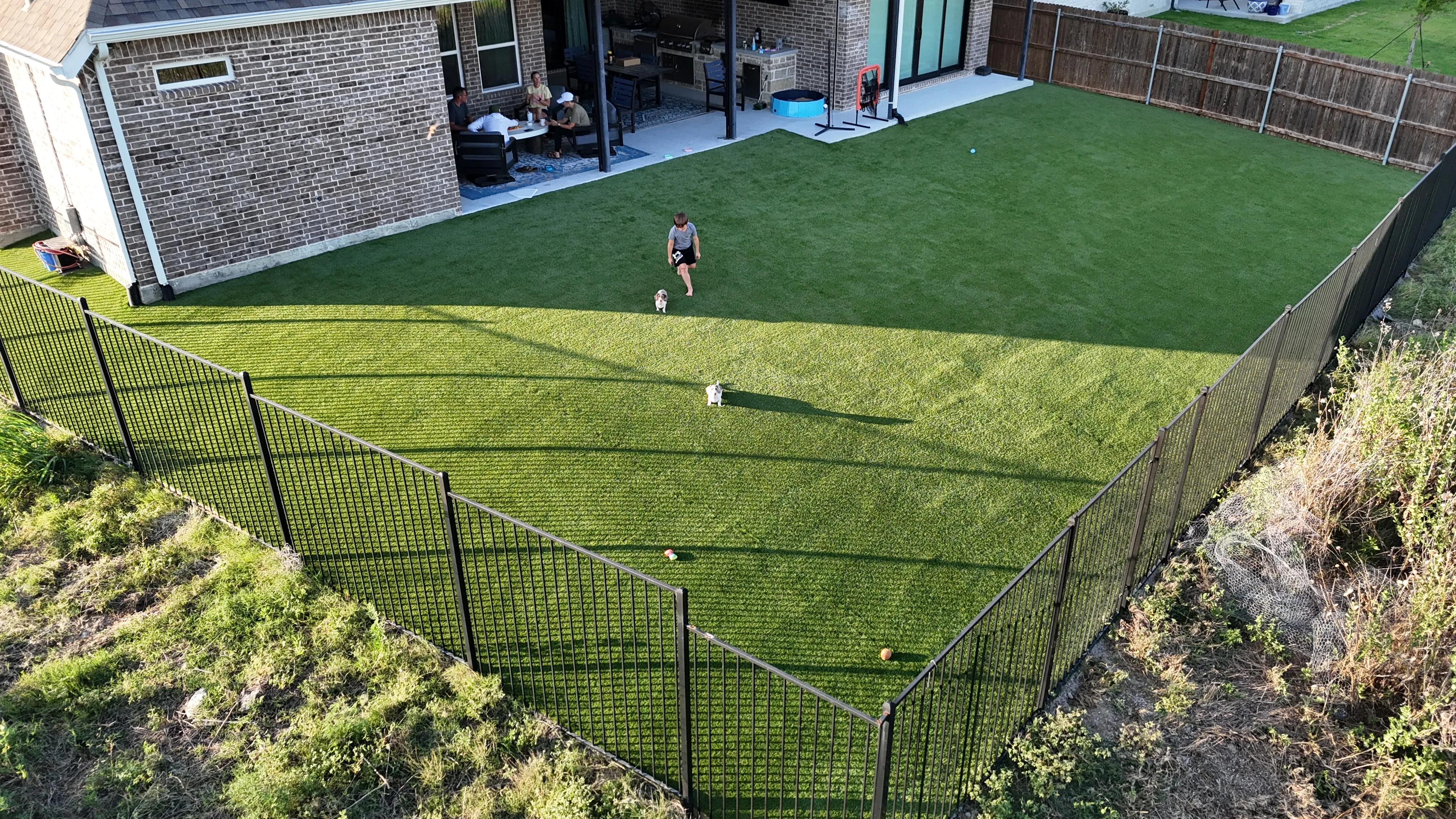 Parks of Aledo full backyard: 2,900 SF of Rymar TriBlend that disappears into the greenbelt feature 2