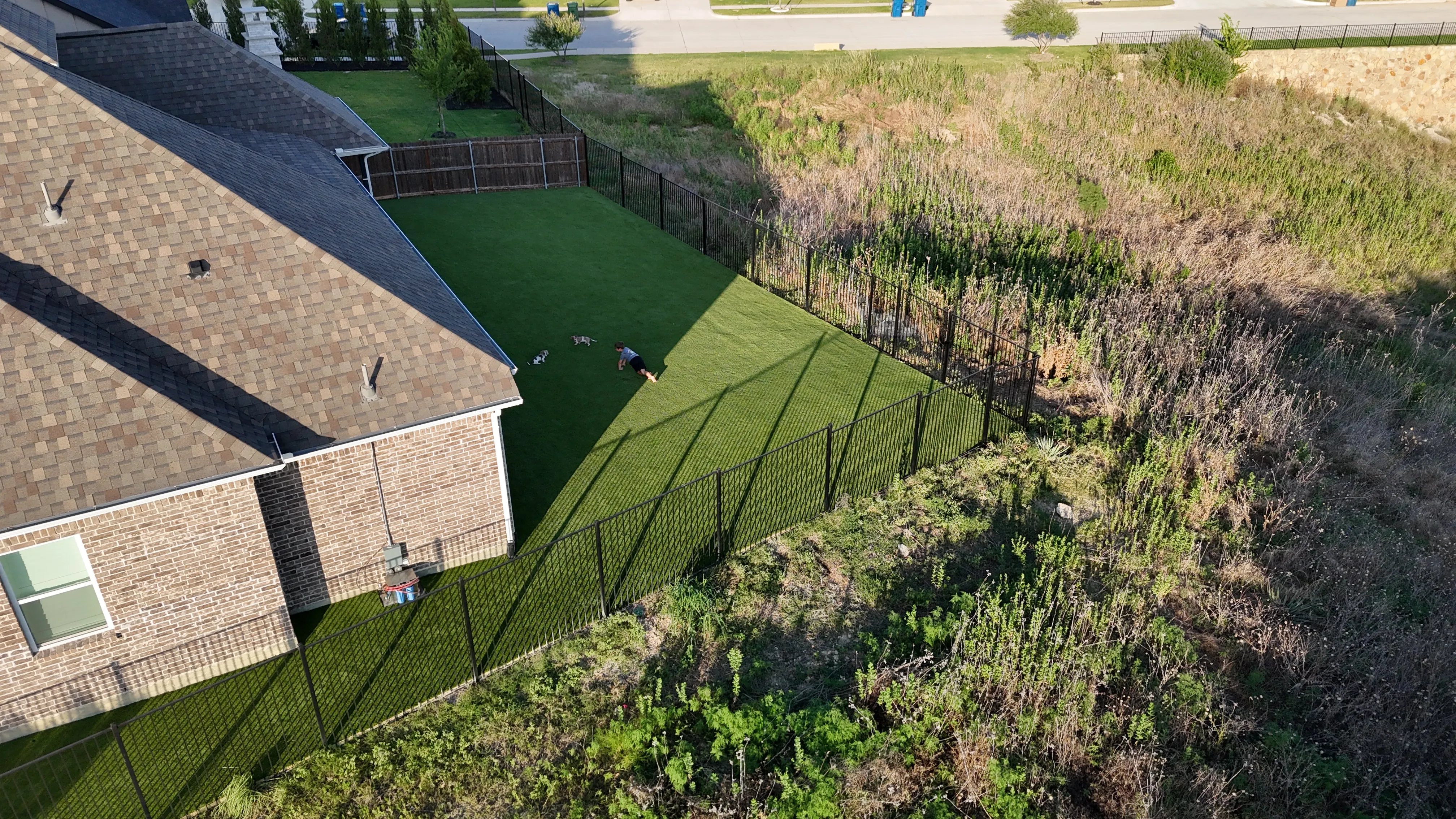Parks of Aledo full backyard: 2,900 SF of Rymar TriBlend that disappears into the greenbelt feature 3