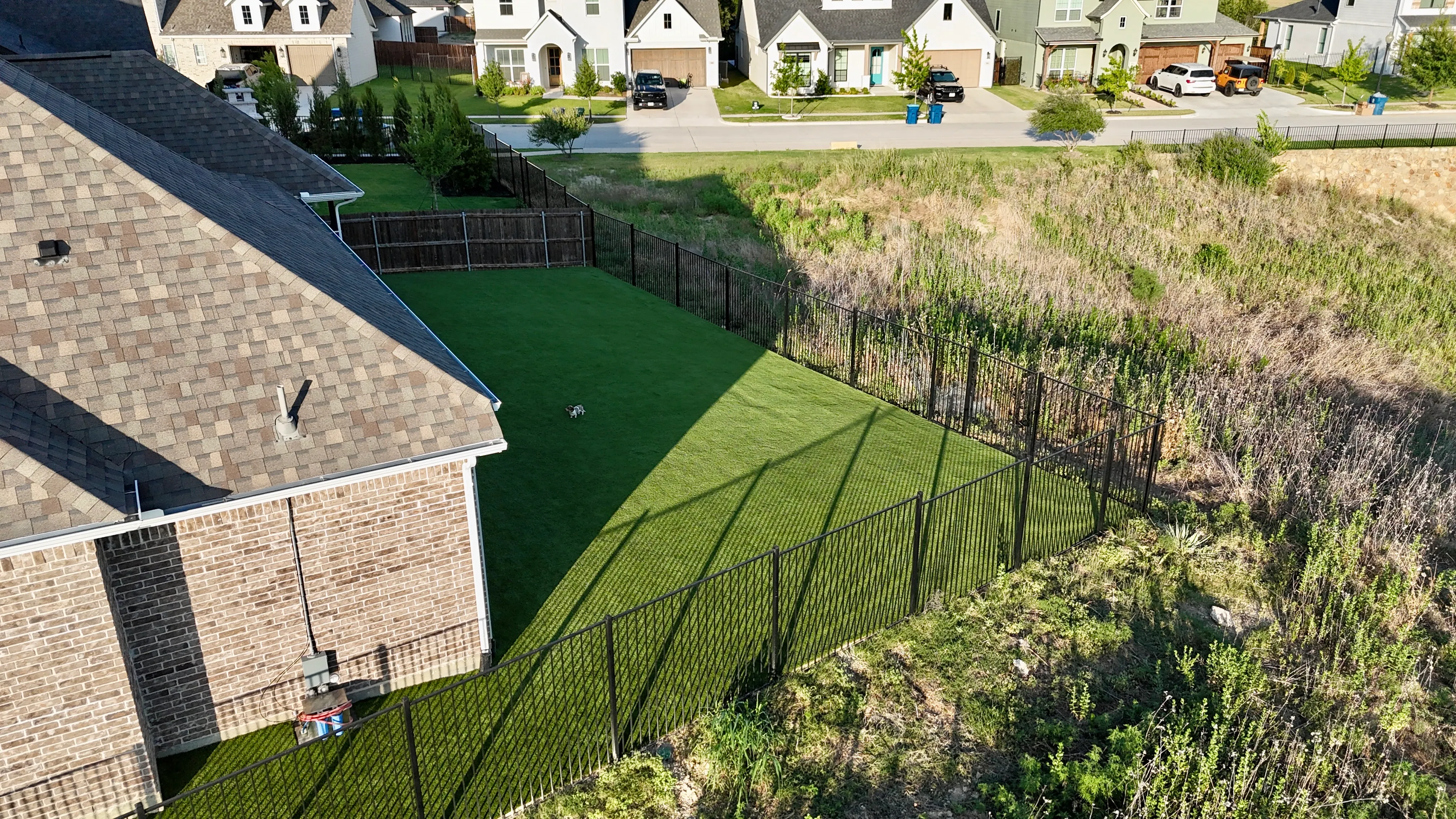 Aerial 1 — Parks of Aledo full backyard: 2,900 SF of Rymar TriBlend that disappears into the greenbelt