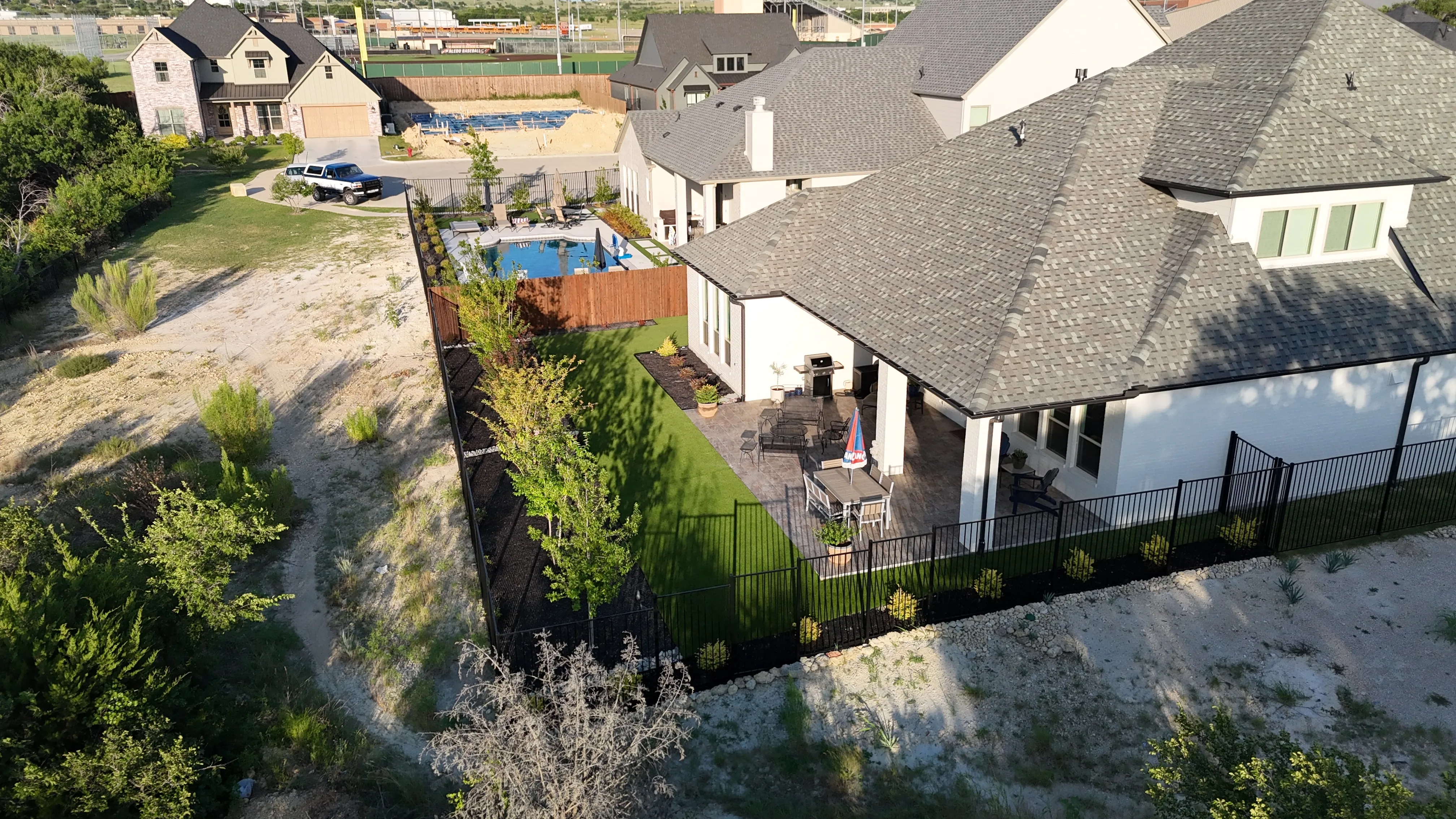 Parks of Aledo new build with Jobe Homes: a high-end greenbelt backyard built to enjoy, not maintain feature 1