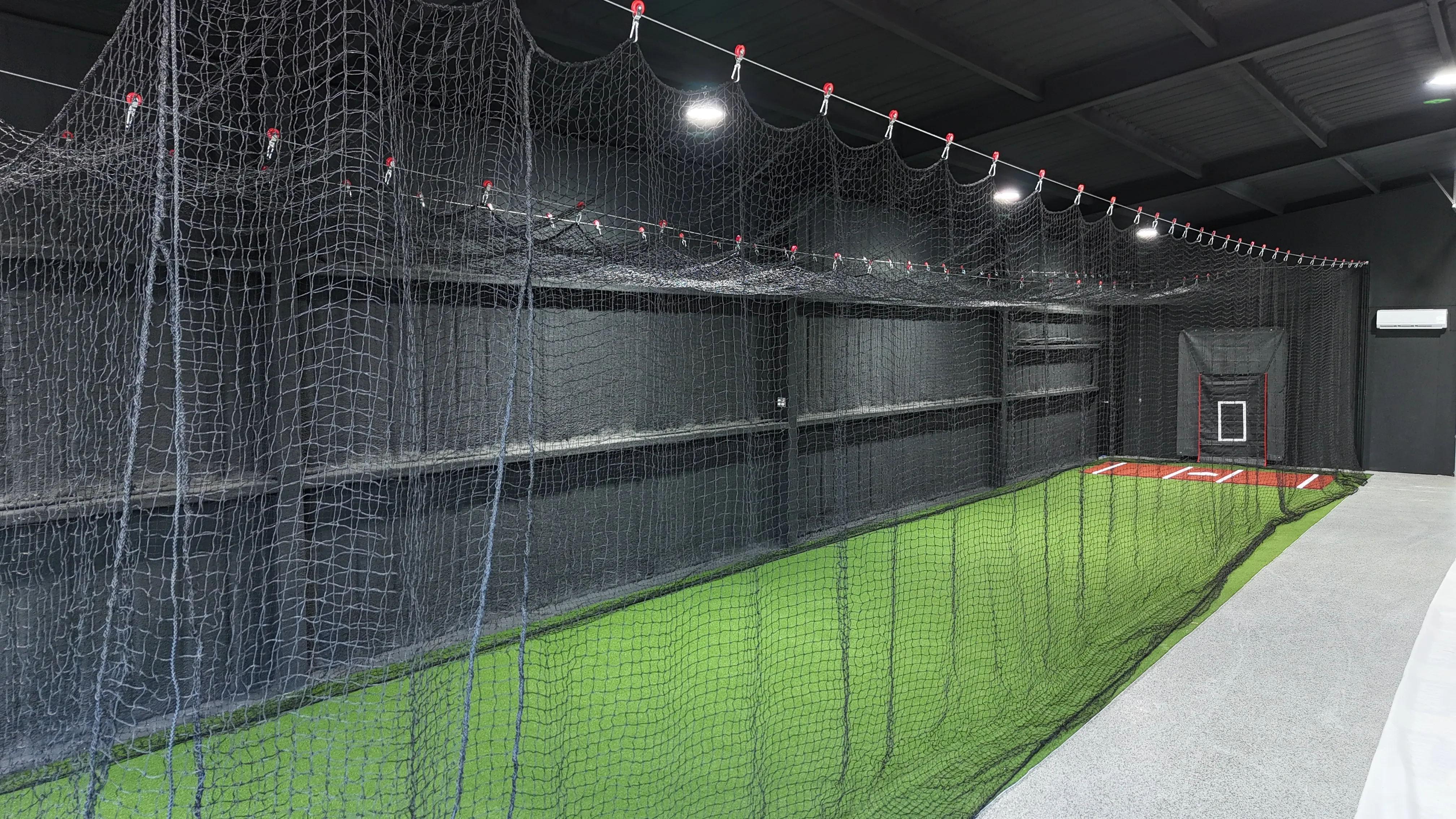 After 4 — Aledo backyard barn batting cage: 70' full-length retractable Cimarron net, Performance Pro turf, clay batter's box