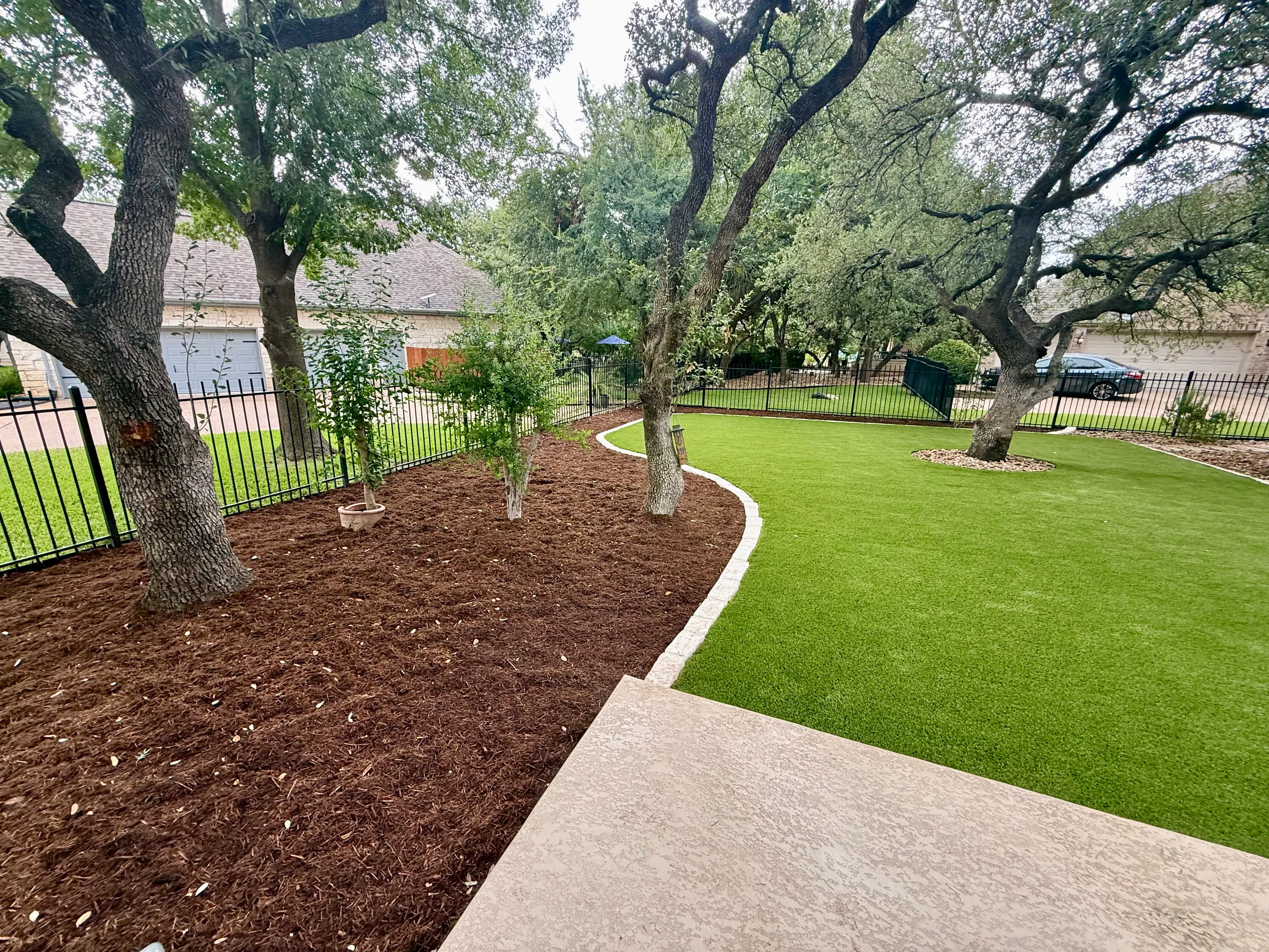 After 5 — Georgetown complete backyard renovation: turf, limestone, and living space under the live oaks