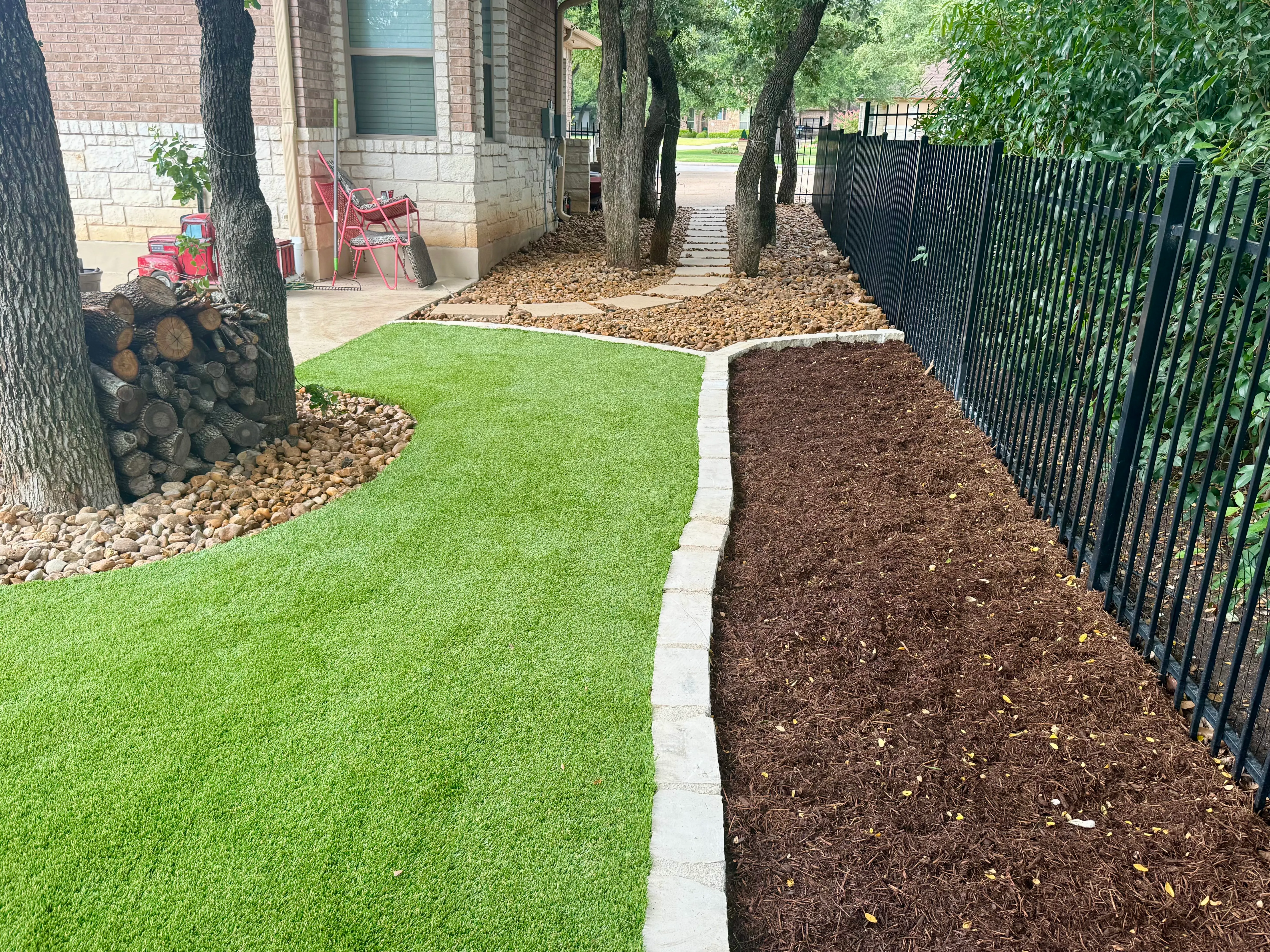 After 8 — Georgetown complete backyard renovation: turf, limestone, and living space under the live oaks