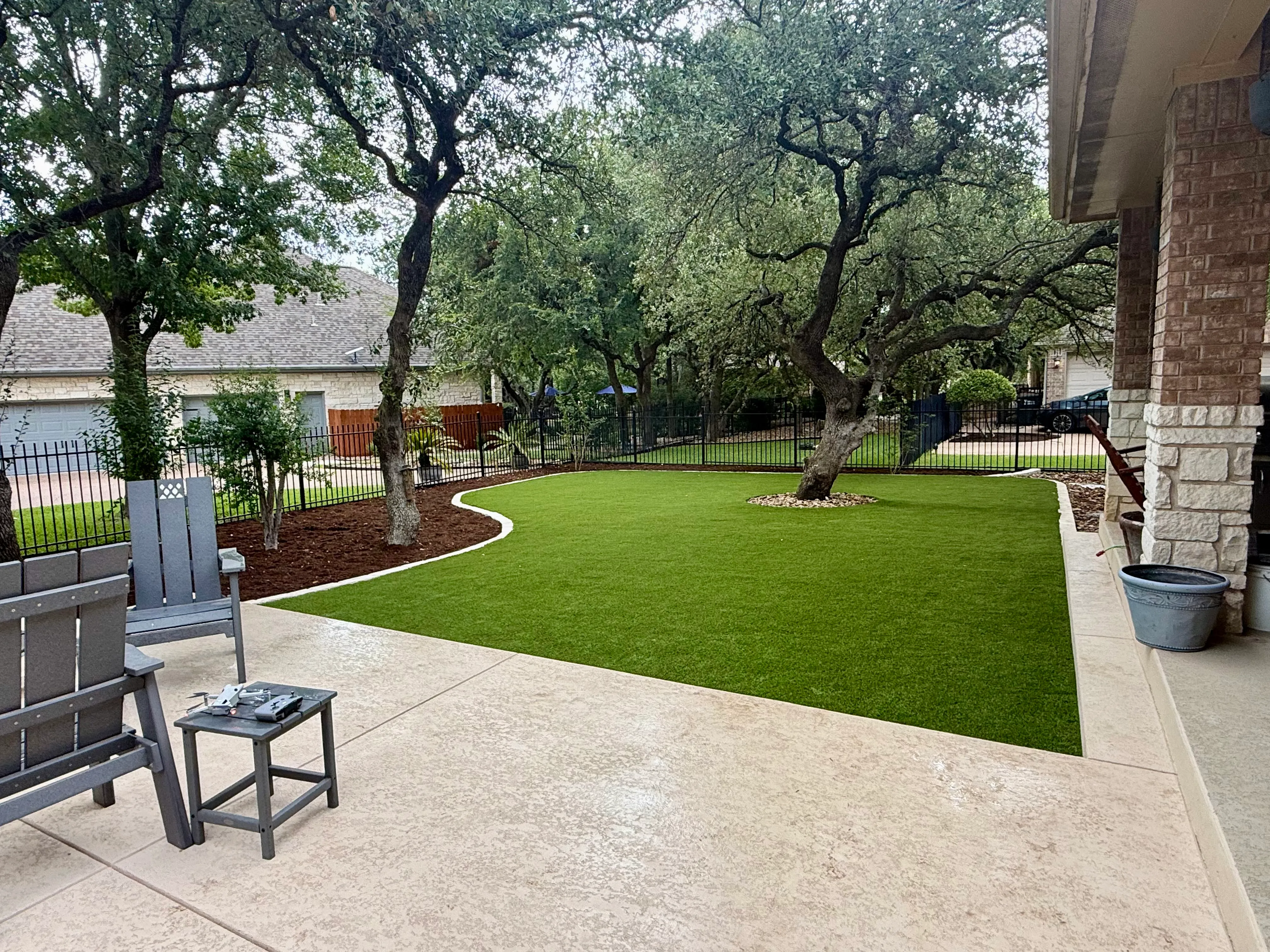 After 11 — Georgetown complete backyard renovation: turf, limestone, and living space under the live oaks