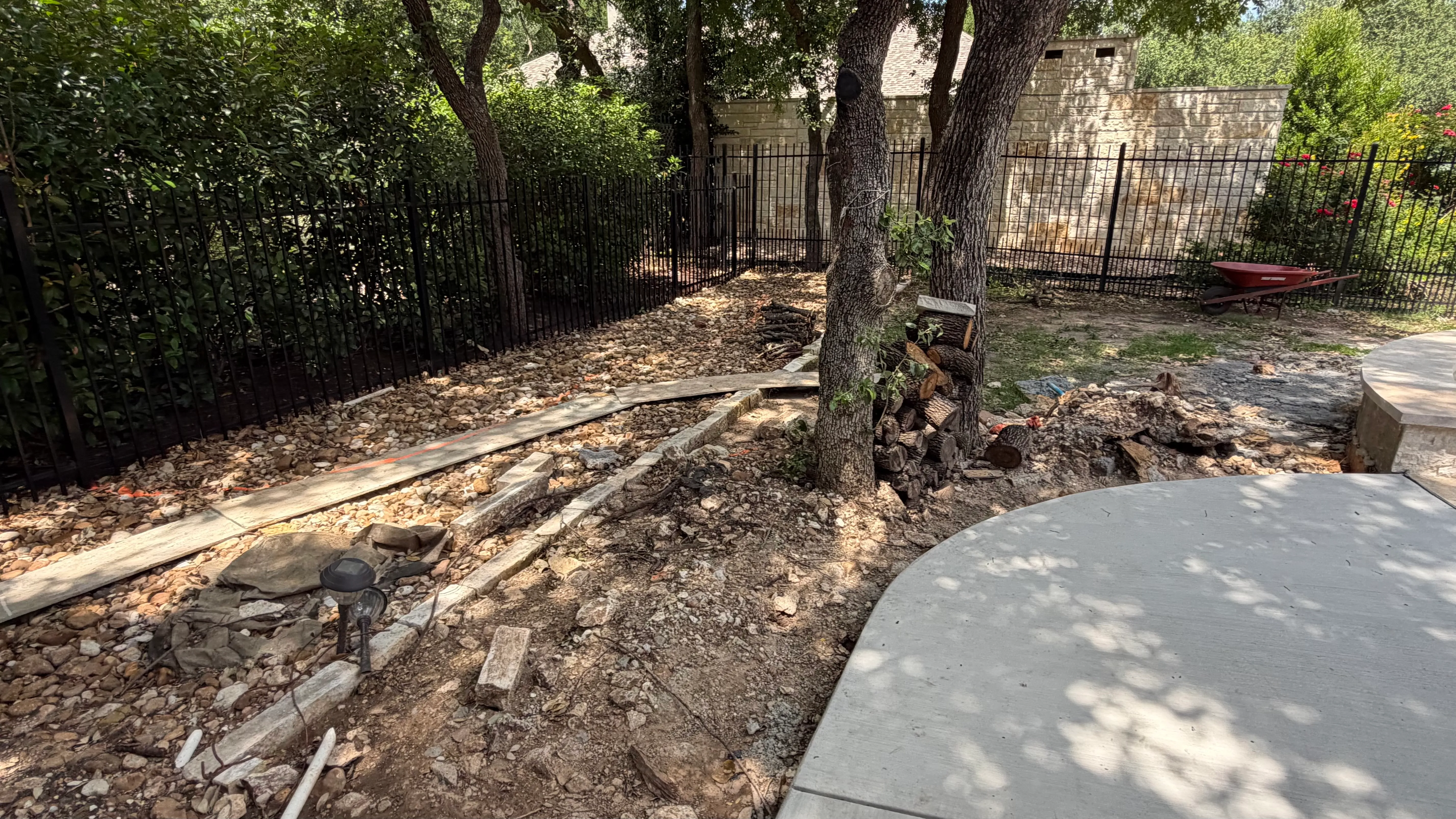 Before 7 — Georgetown complete backyard renovation: turf, limestone, and living space under the live oaks