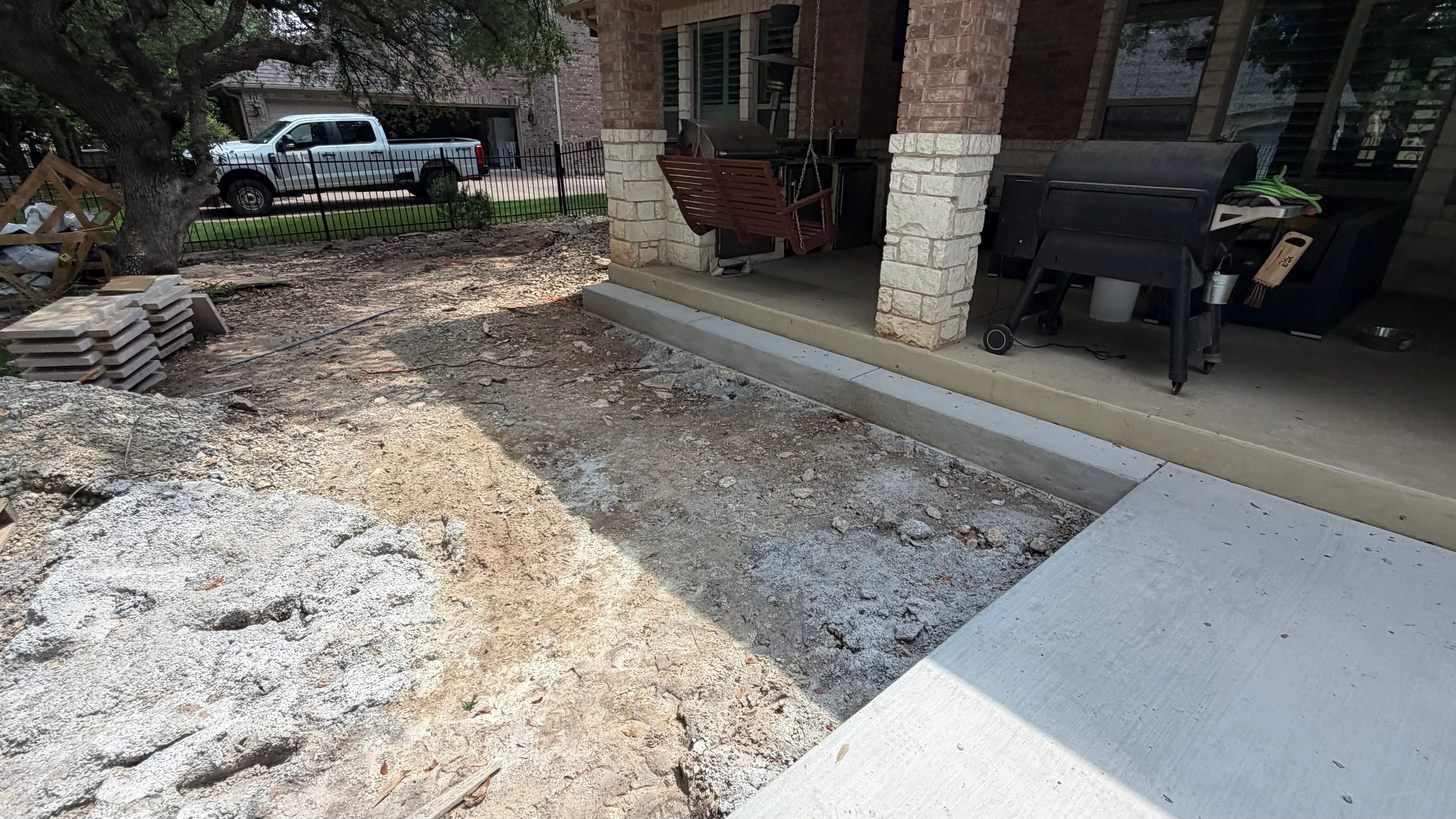 Before 11 — Georgetown complete backyard renovation: turf, limestone, and living space under the live oaks