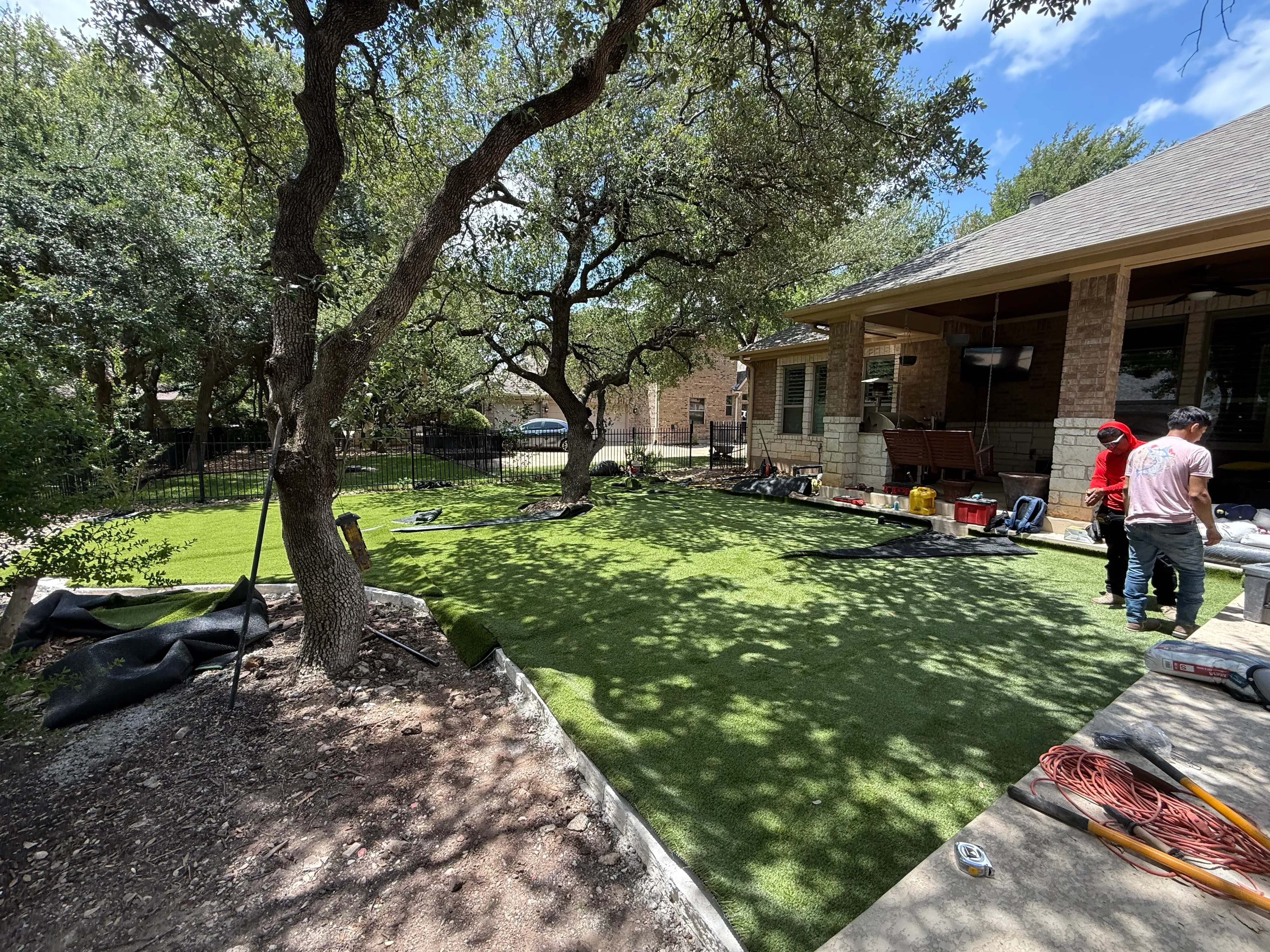 Construction 2 — Georgetown complete backyard renovation: turf, limestone, and living space under the live oaks