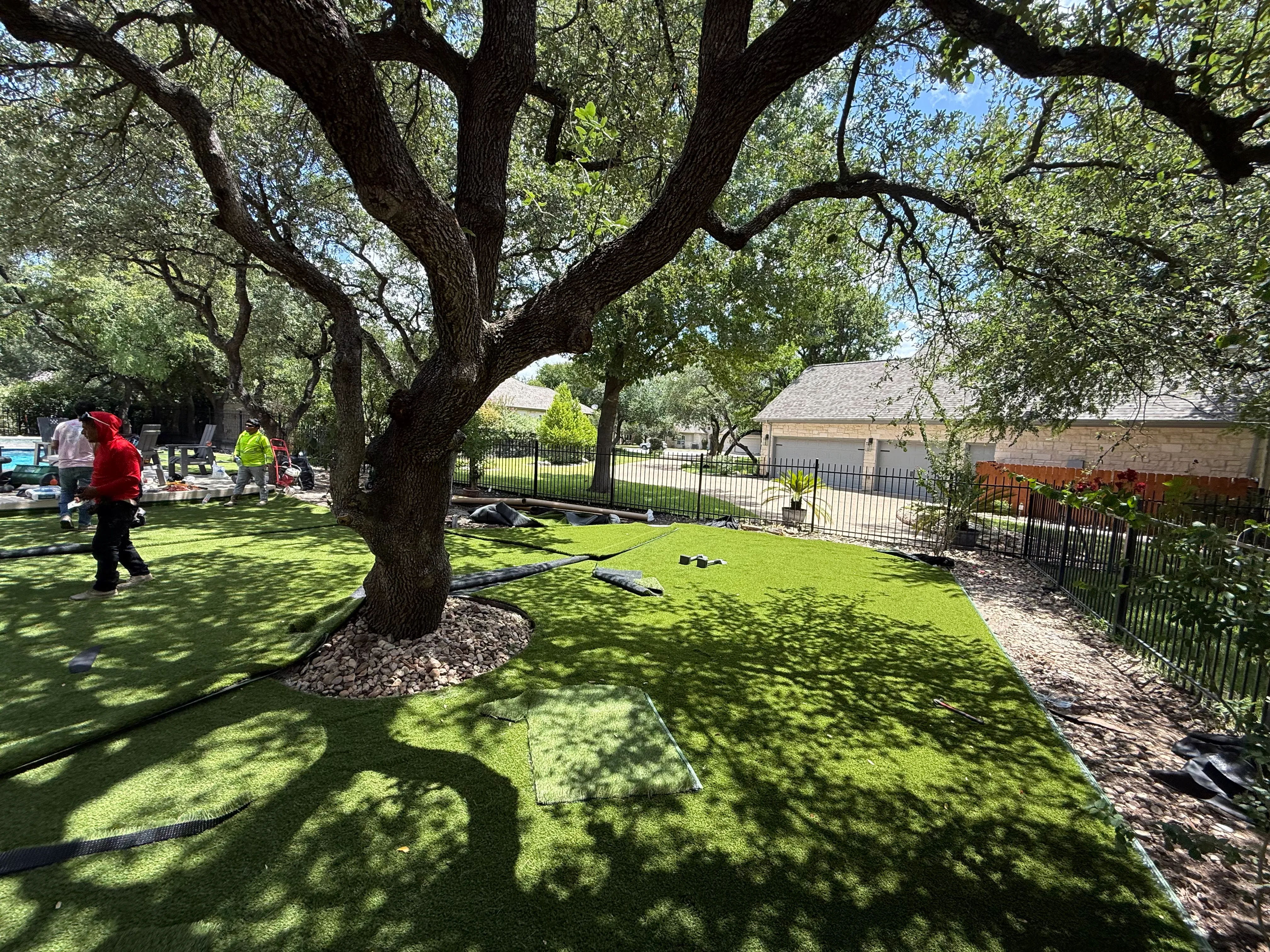 Construction 3 — Georgetown complete backyard renovation: turf, limestone, and living space under the live oaks