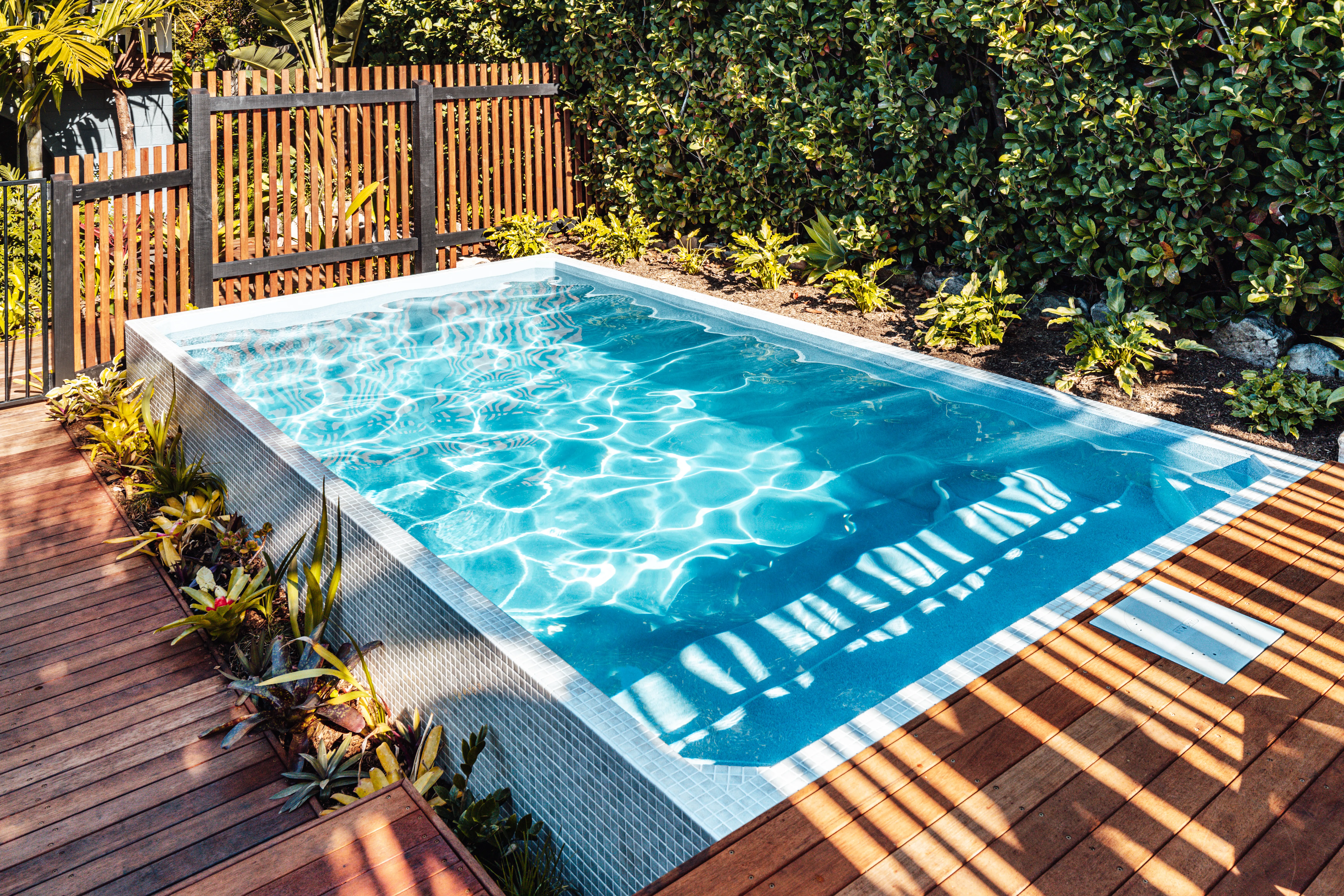 Plungie pool at a residential property with mature landscaping