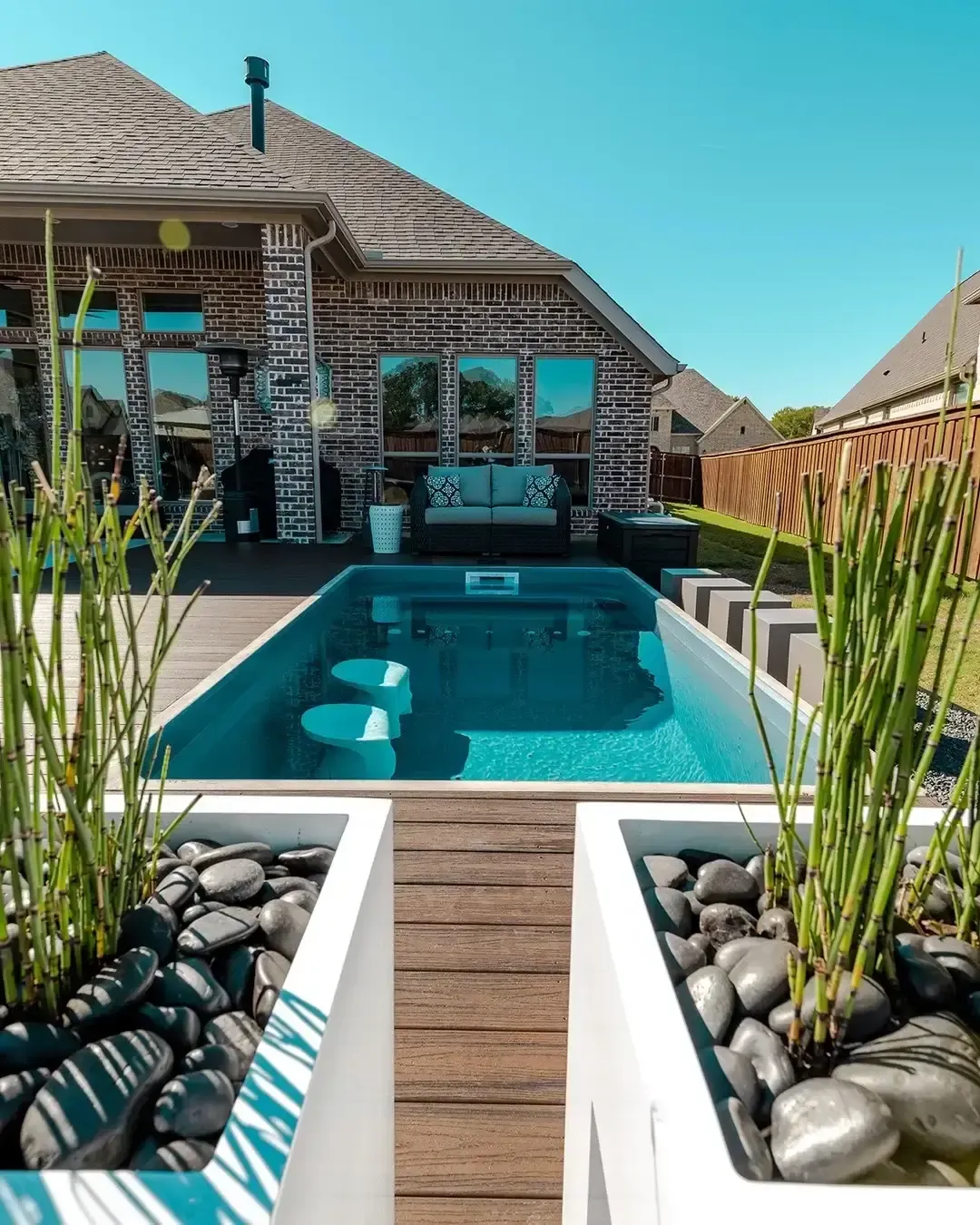Plungie Arena round plunge pool in a residential backyard