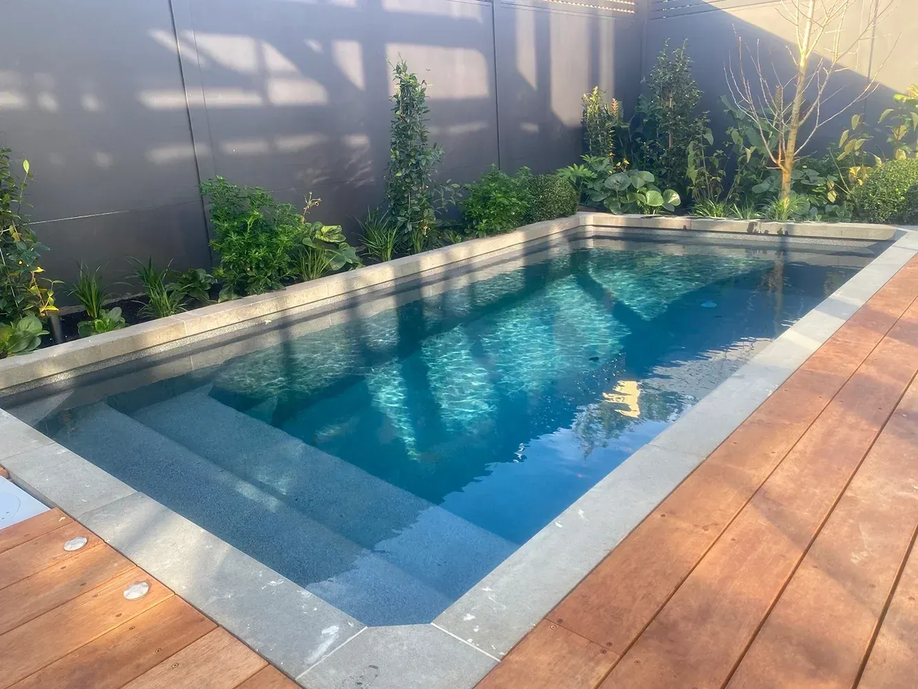 Plungie Studio with stone surround and modern landscape edging