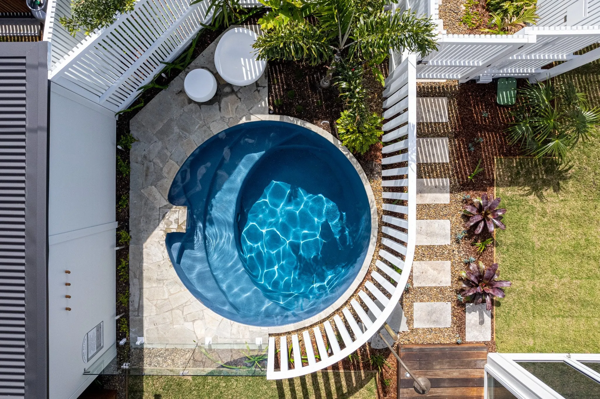 Plungie pool with outdoor lounge area and landscape integration